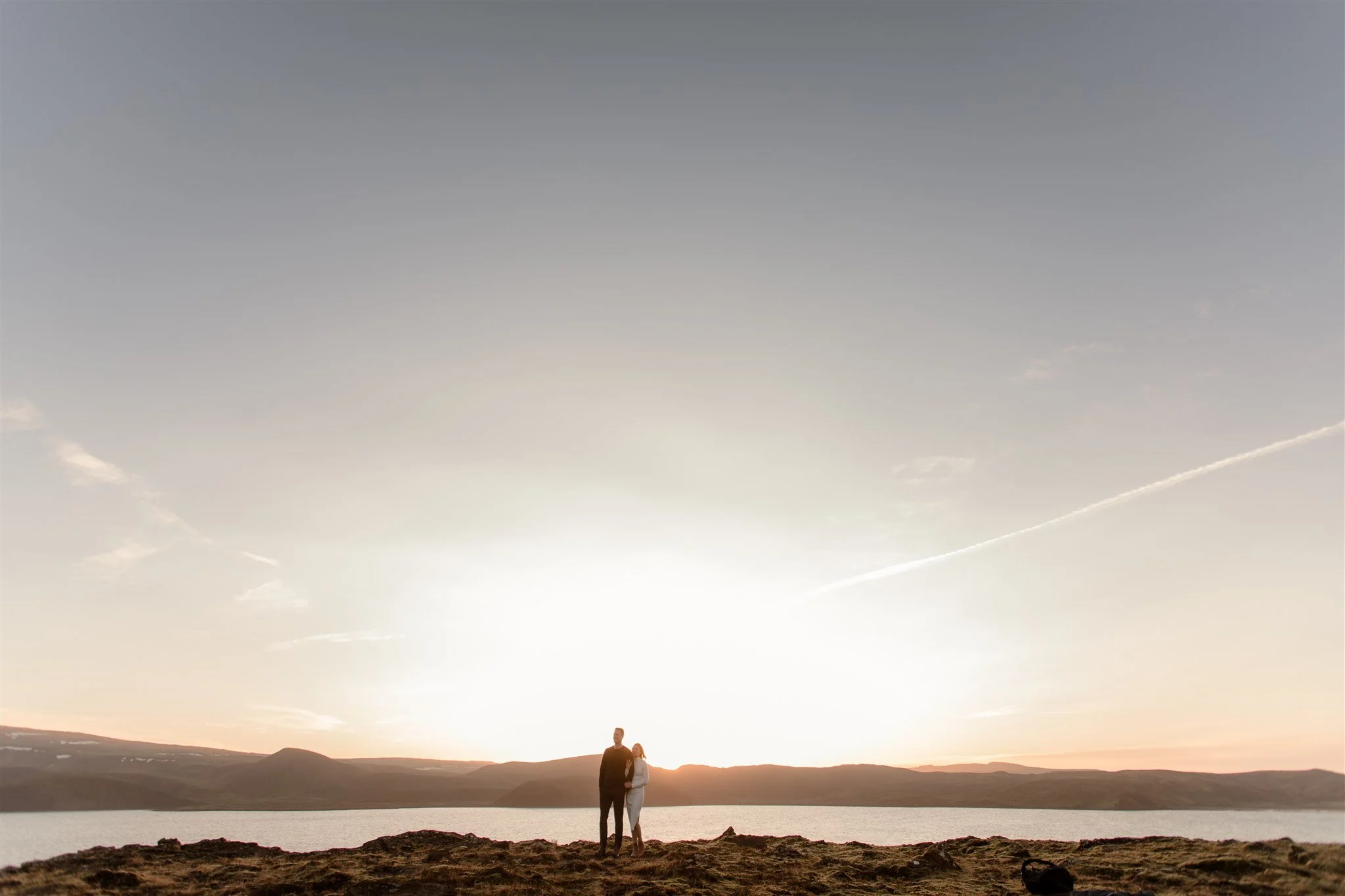  Iceland engagement photo with sunrise dreamy light with couple by water by Iceland engagement proposal photographer steph zakas 