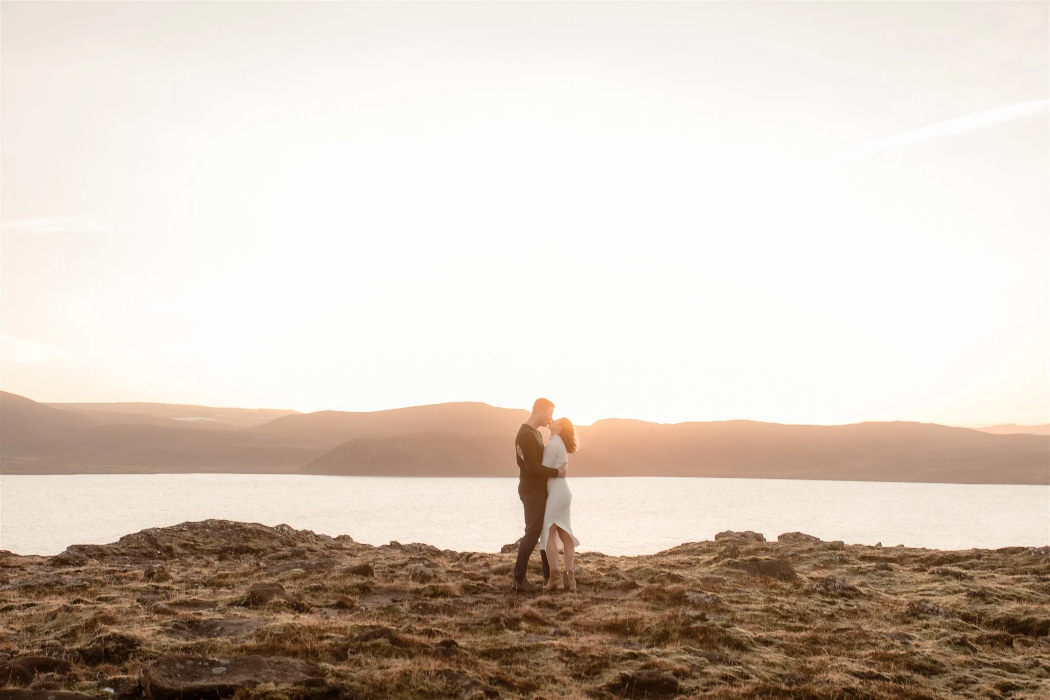  Iceland engagement photo with sunrise dreamy light with couple by water by Iceland engagement proposal photographer steph zakas 