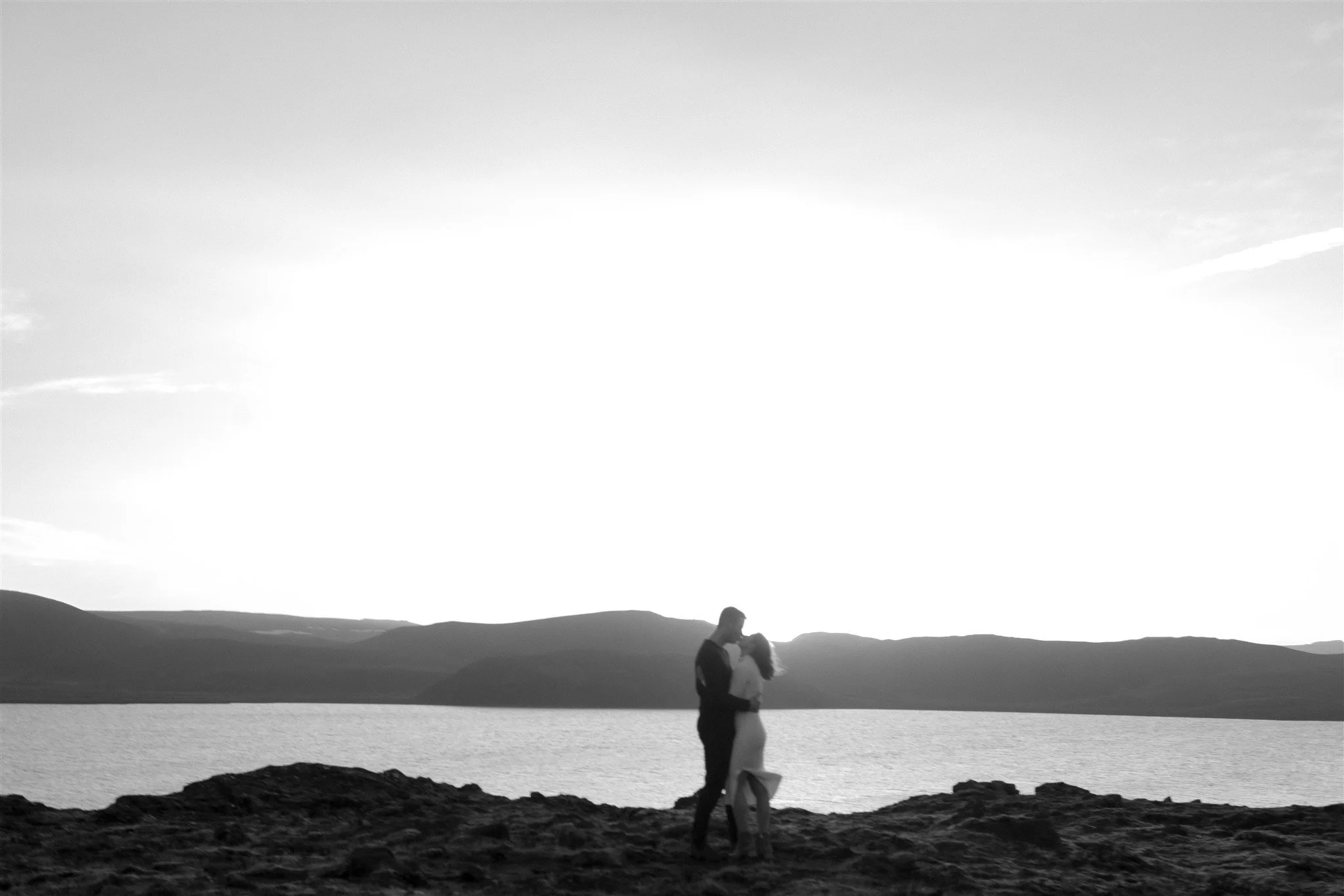  Iceland engagement photo with sunrise dreamy light with couple by water by Iceland engagement proposal photographer steph zakas 
