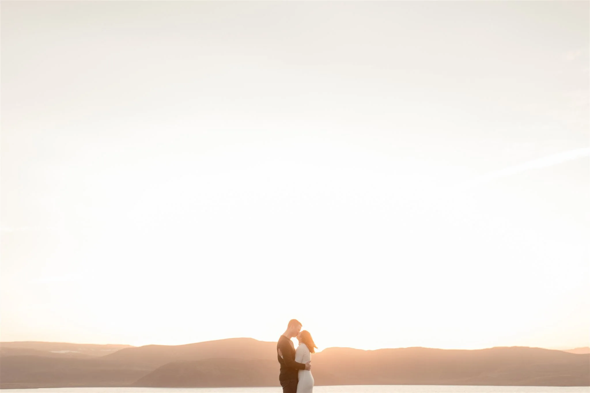  Iceland engagement photo with sunrise dreamy light with couple by water by Iceland engagement proposal photographer steph zakas 
