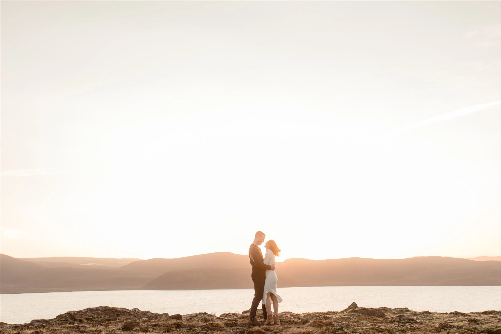  Iceland engagement photo with sunrise dreamy light with couple by water by Iceland engagement proposal photographer steph zakas 