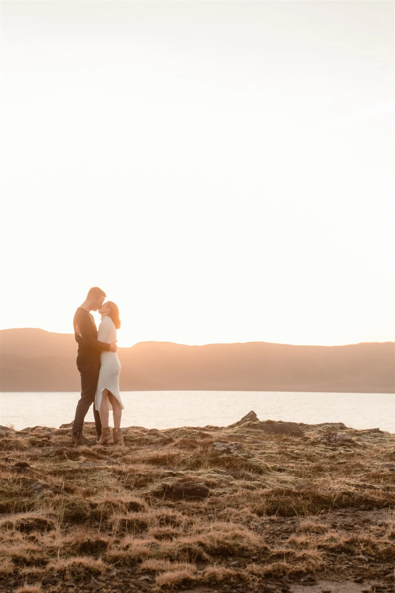  Iceland engagement photo with sunrise dreamy light with couple by water by Iceland engagement proposal photographer steph zakas 