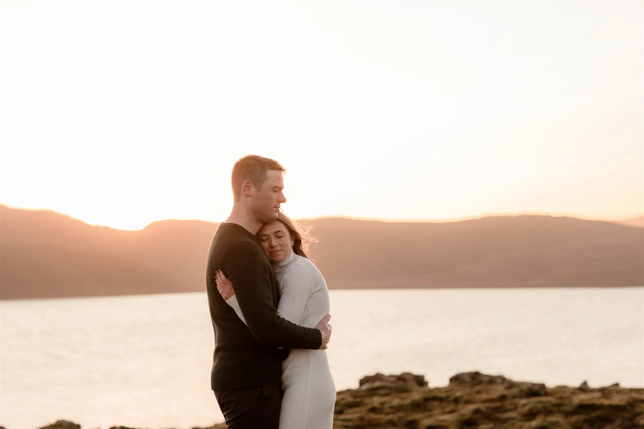  Iceland engagement photo with sunrise dreamy light with couple by water by Iceland engagement proposal photographer steph zakas 
