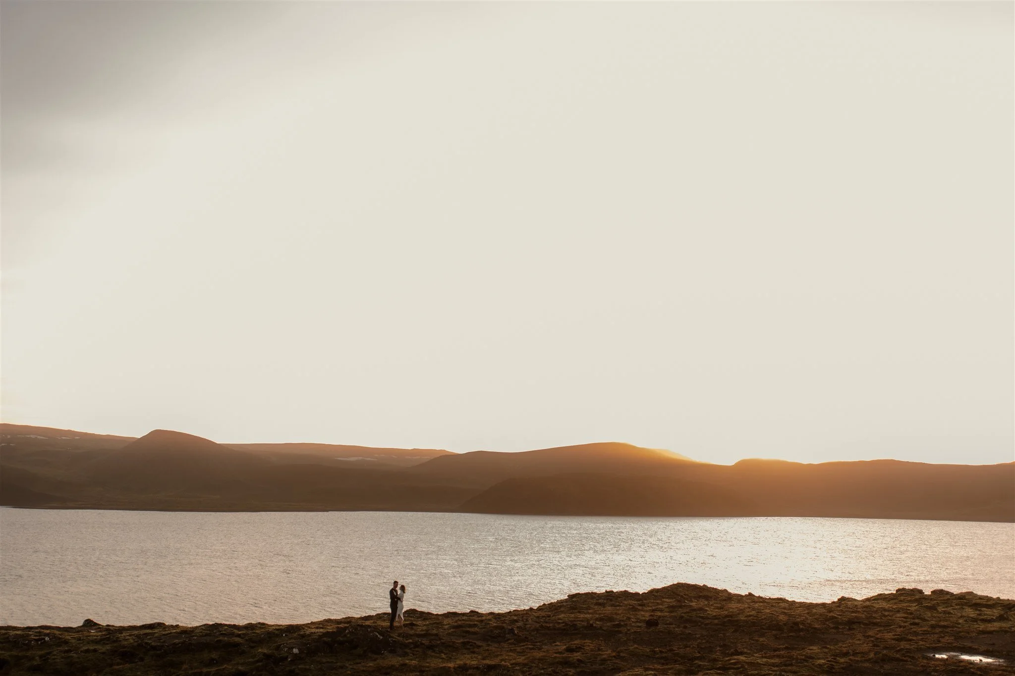  Iceland engagement photo with sunrise dreamy light with couple by water by Iceland engagement proposal photographer steph zakas 