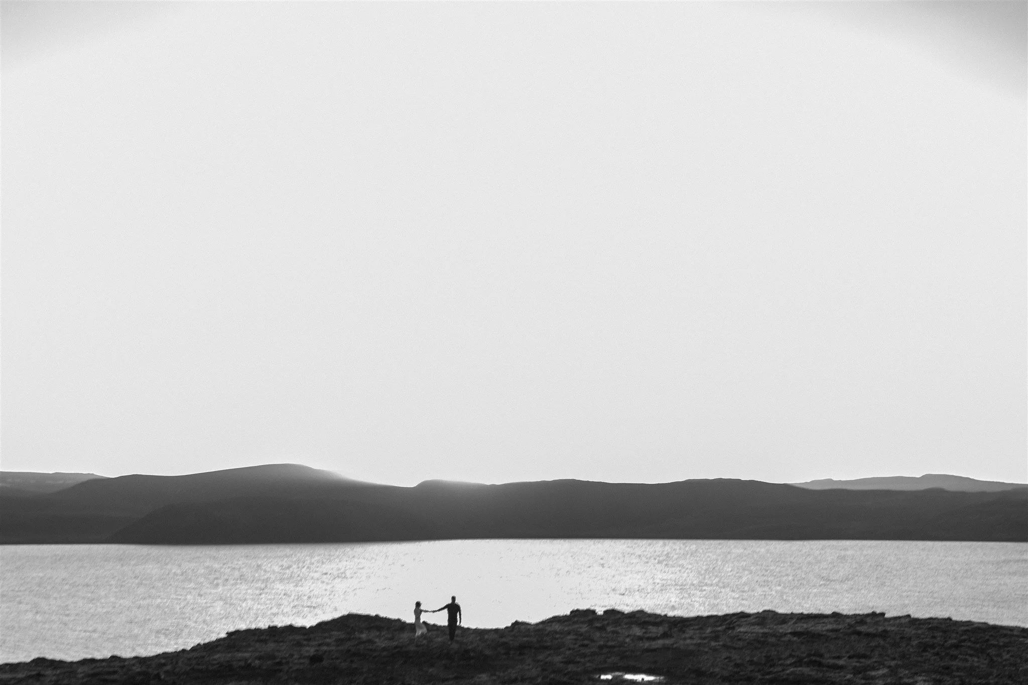  Iceland engagement photo with sunrise dreamy light with couple by water by Iceland engagement proposal photographer steph zakas 