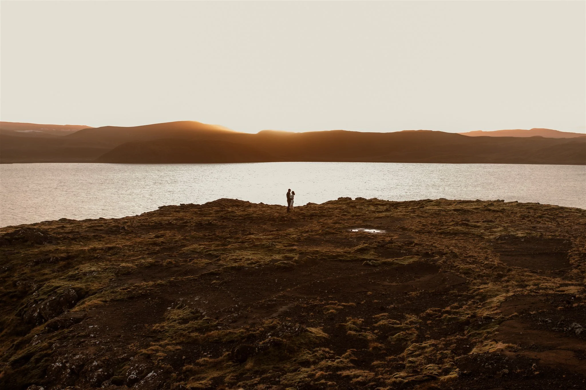  Iceland engagement photo with sunrise dreamy light with couple by water by Iceland engagement proposal photographer steph zakas 