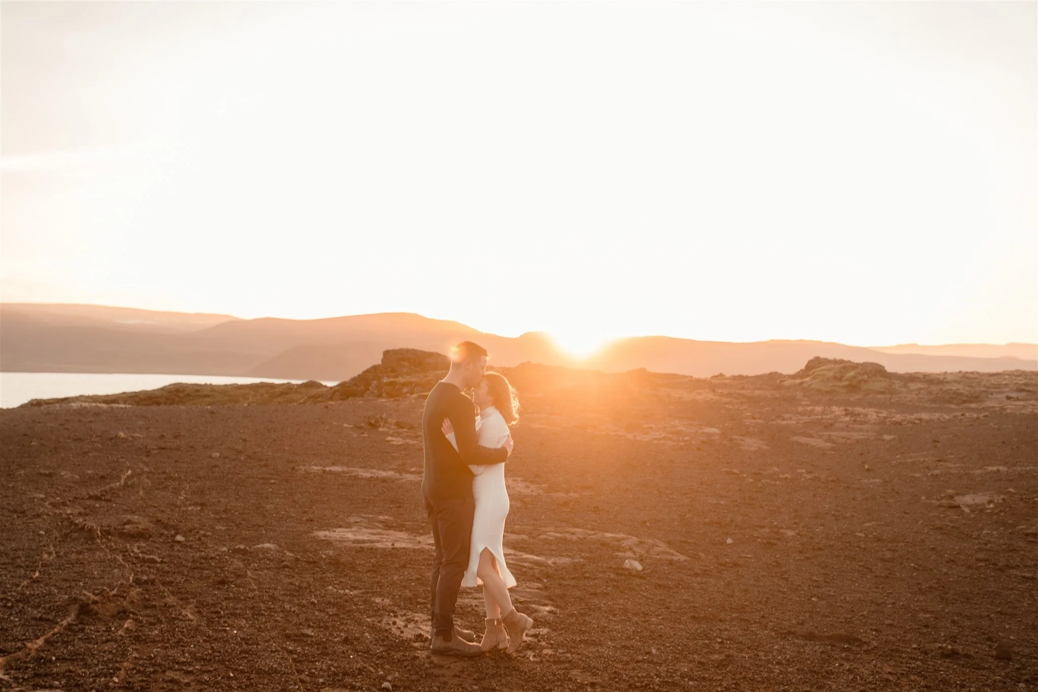  Iceland engagement photo with sunrise dreamy light with couple by water by Iceland engagement proposal photographer steph zakas 