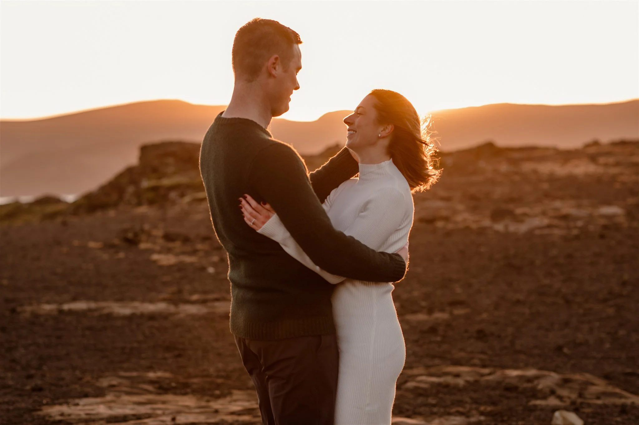  Iceland engagement photo with sunrise dreamy light with couple by water by Iceland engagement proposal photographer steph zakas 
