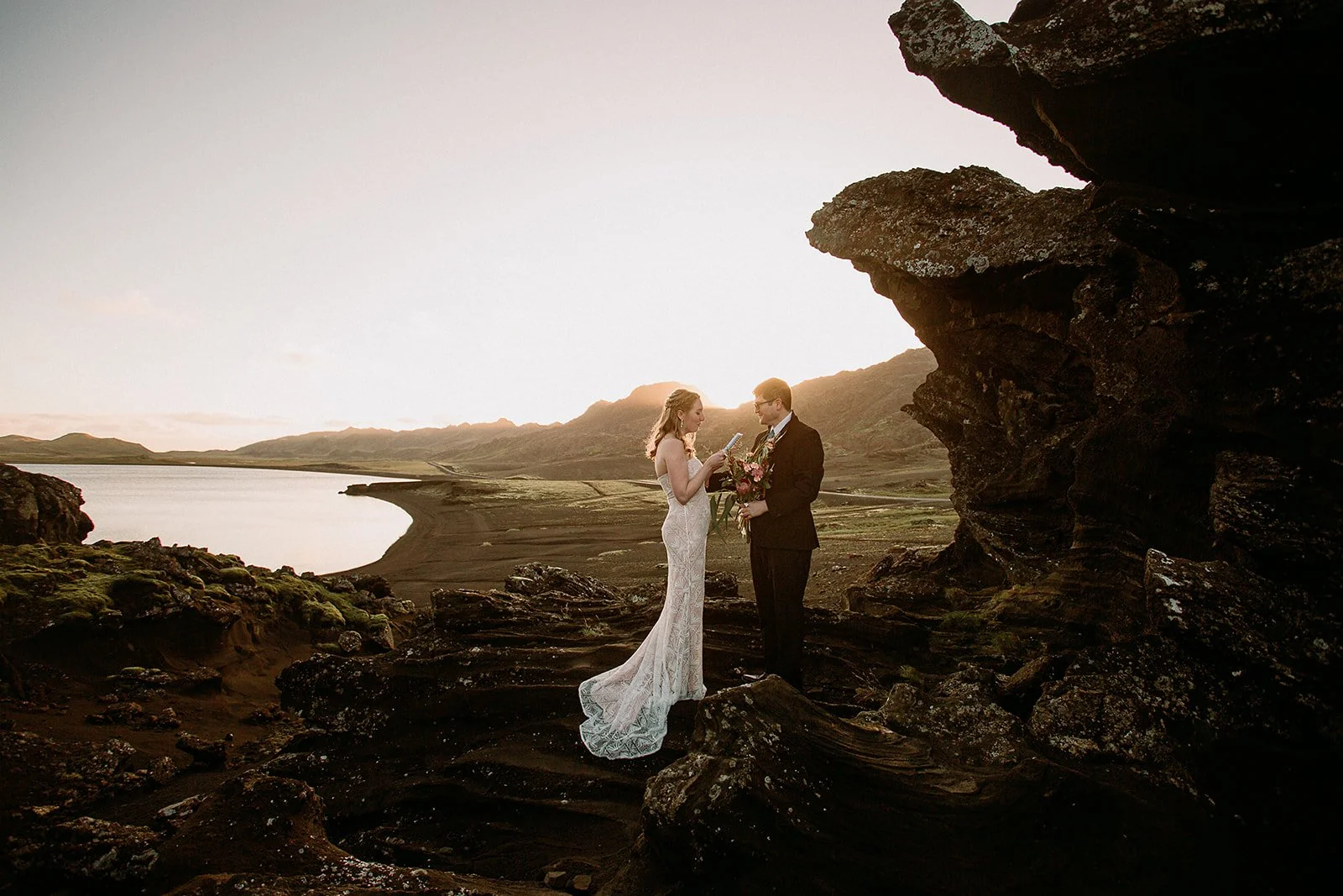A Private South West Iceland Elopement at Sunset -- couple saying vows
