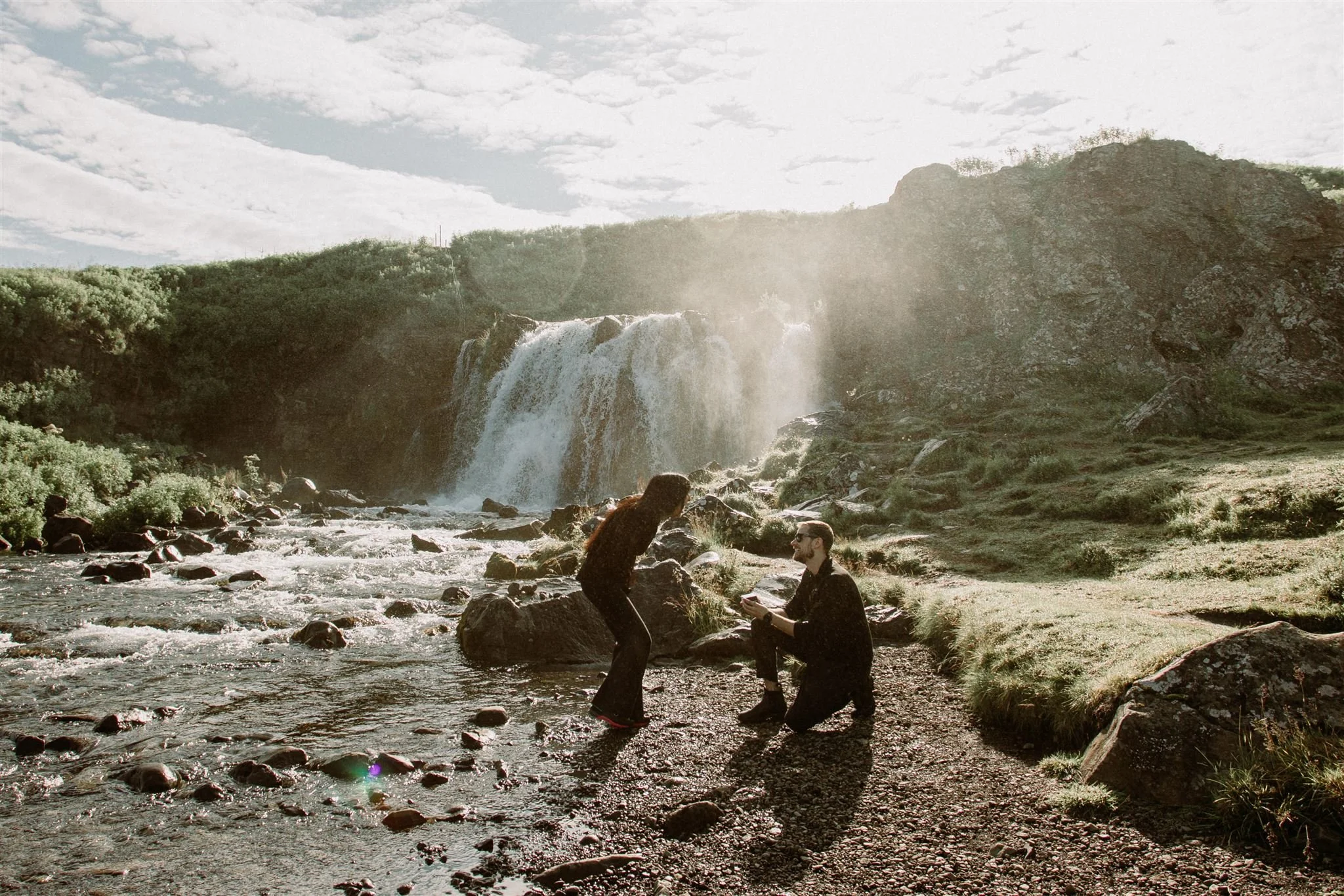 Iceland proposal at a secluded and private waterfall looking like lord of the rings film