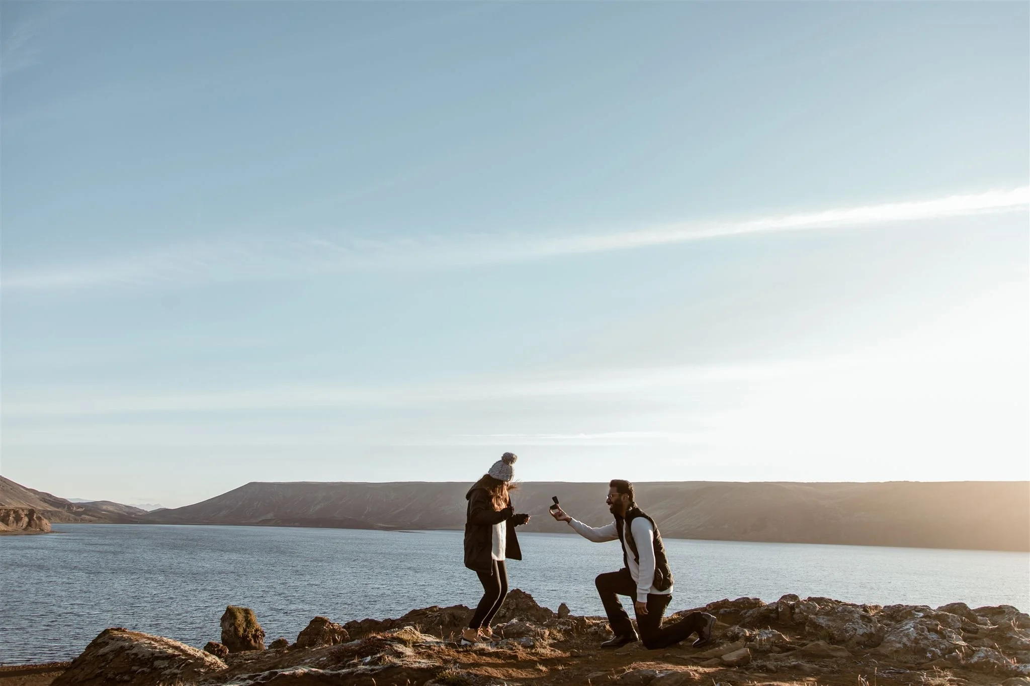 Iceland Marriage Proposal Image: A couple gets engaged in Iceland on vacation with a stunning backdrop.