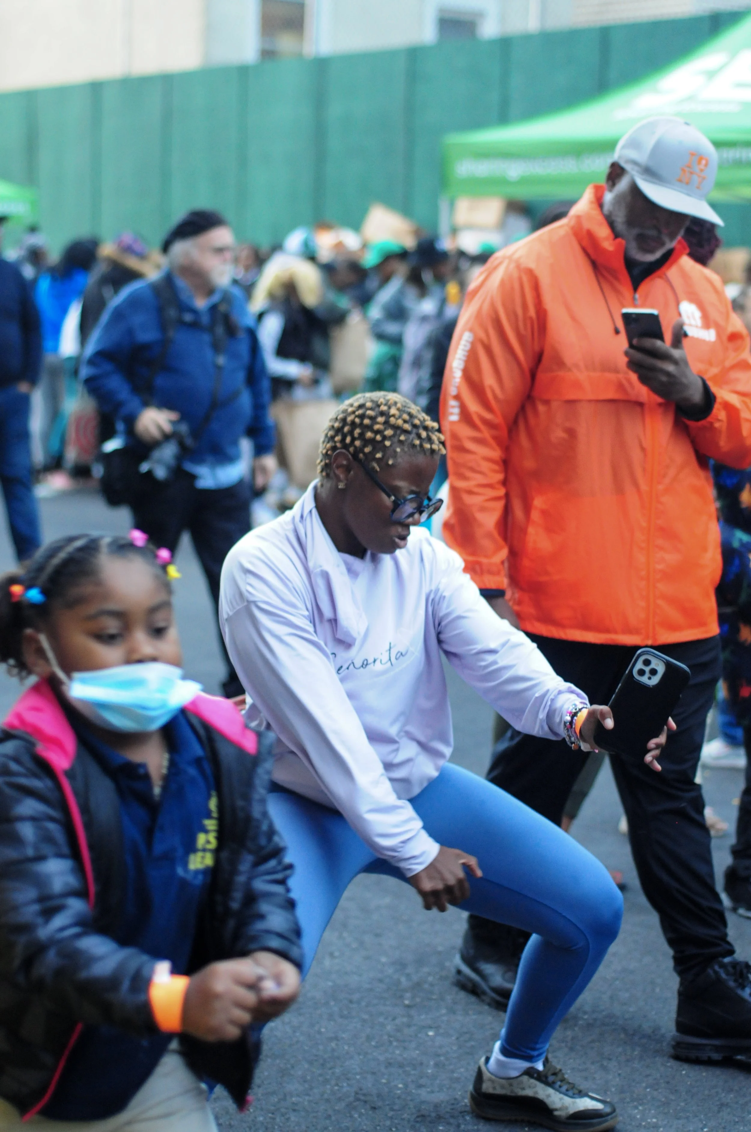 September 2023, Bronx, NY - Woman dancing at a "Feed The Block" event
