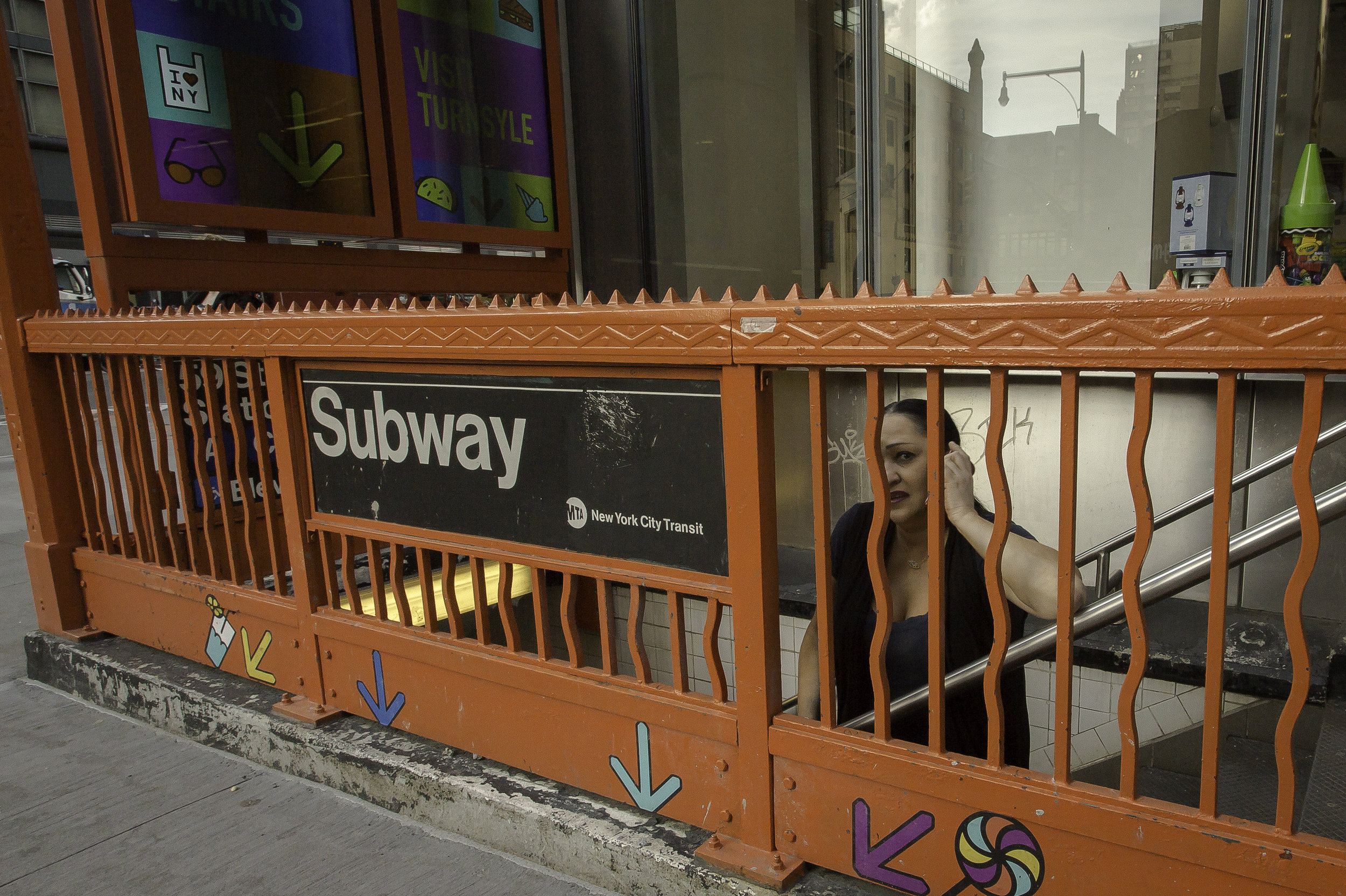 Woman_on_Orange_Railing_Leading_to_Subway_Looser_Version.jpg