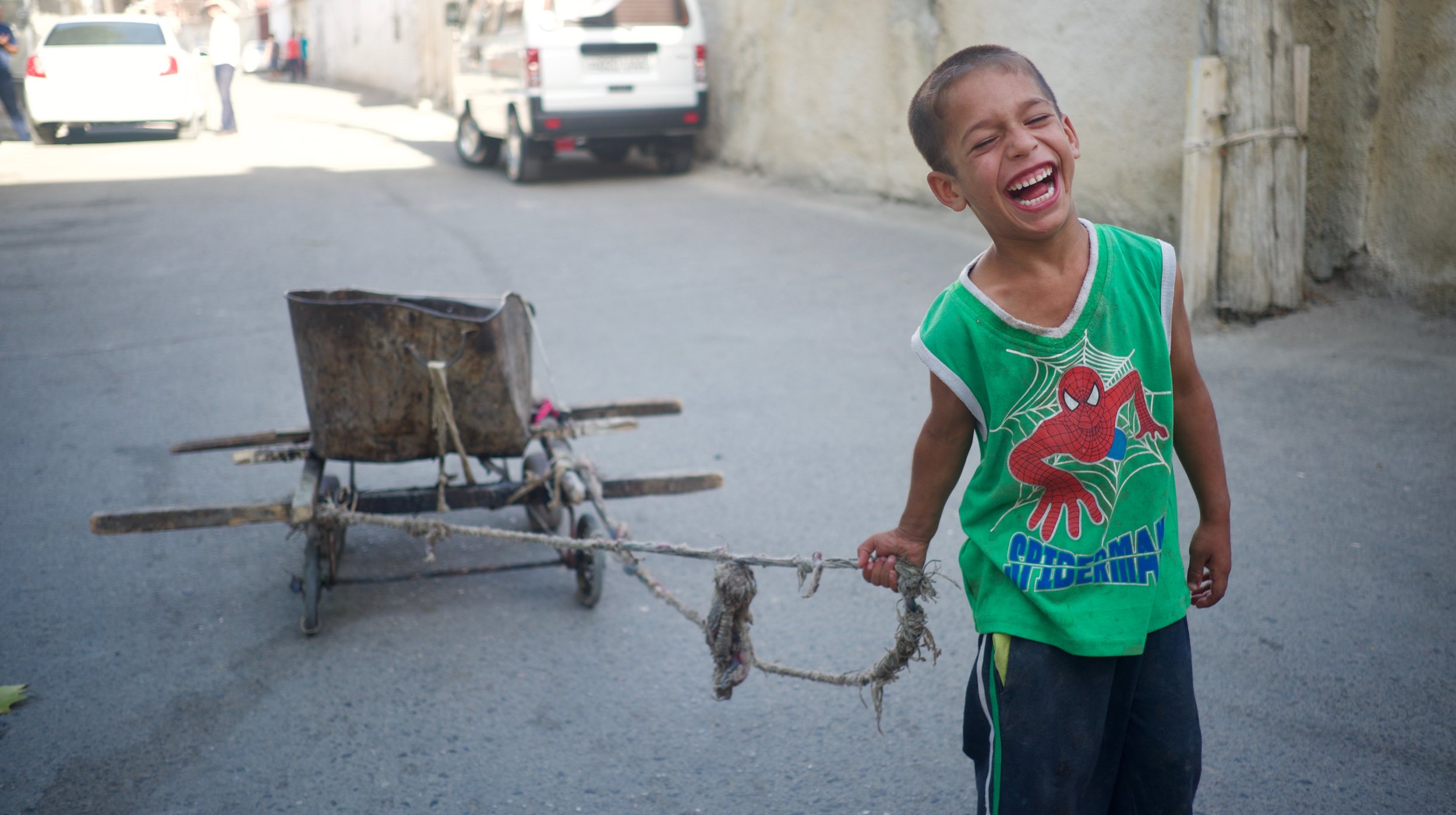  Happy kid and his cart in Bukhara, Tajikistan. 