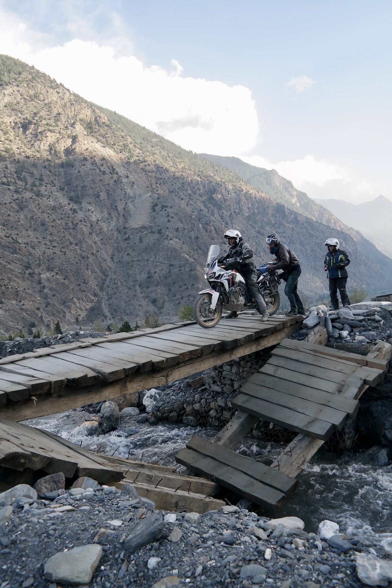  Crossing a decidedly dodgy bridge in the upper Mustang valley, Nepal, in the Annapurna range. 