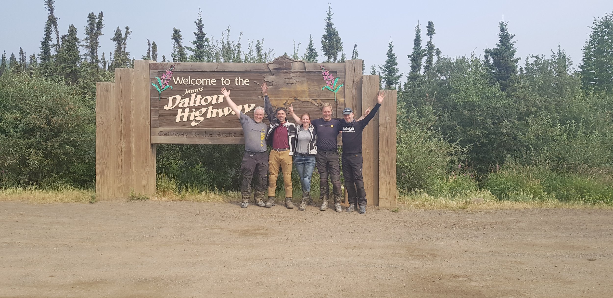  Dalton Highway sign with Jeff Davison, Davide, Jackie, Frank Lammers and Jonathon Peck. 