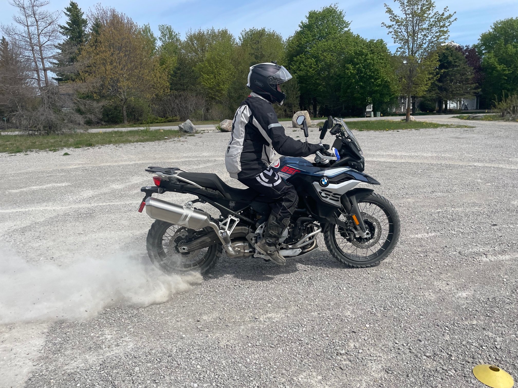  Motorcycle spinning rear tire in sand.   