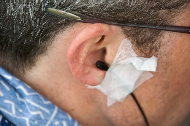  Ian Walker, Professor of Psychology at Swansea University in South Wales, with in-ear microphone attached. 