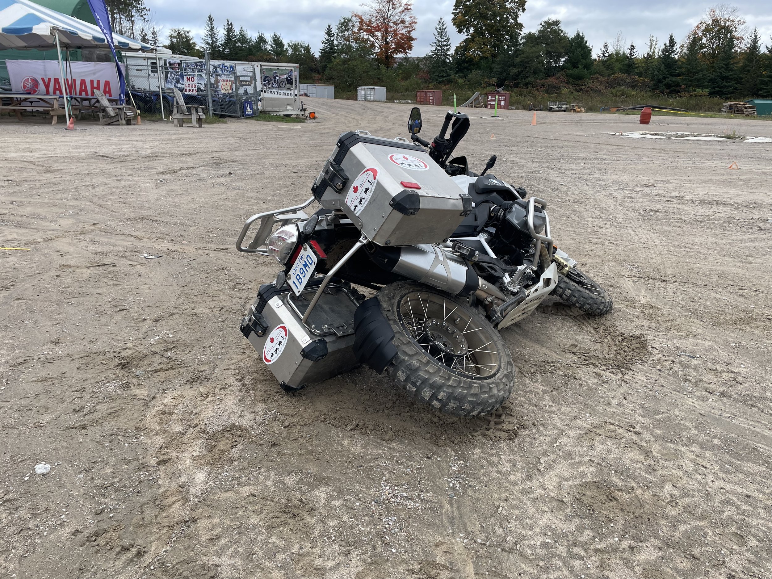  Motorcycle laying on the ground. 