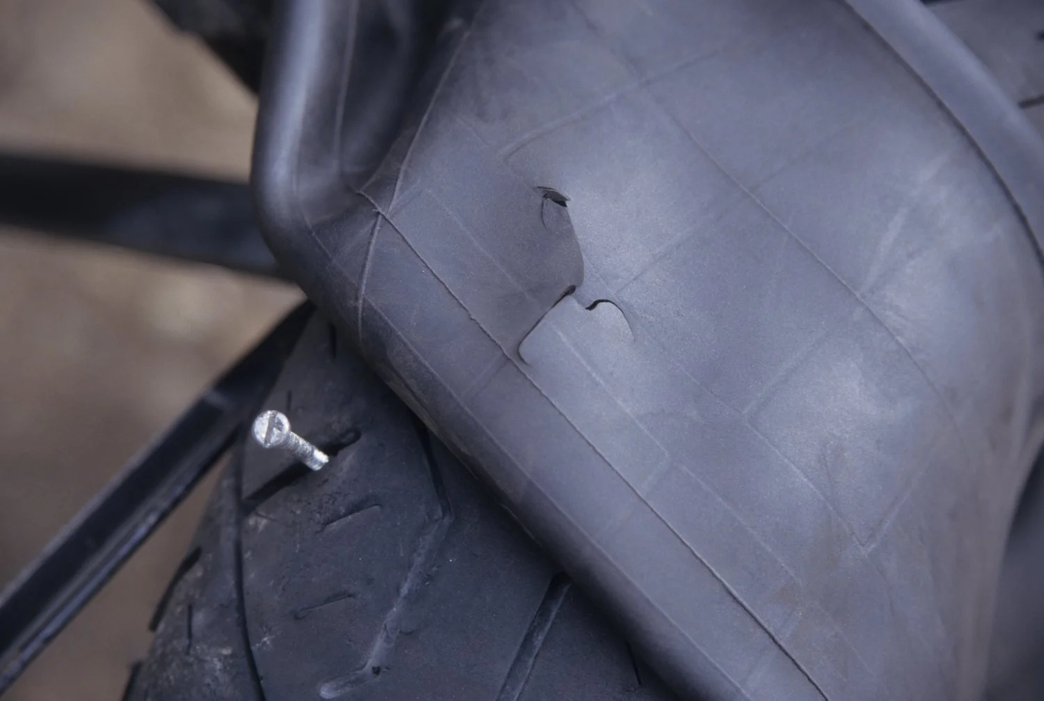  Grant Johnson - Flat tire (split) caused by a nail in Peru. Always carry a spare. 