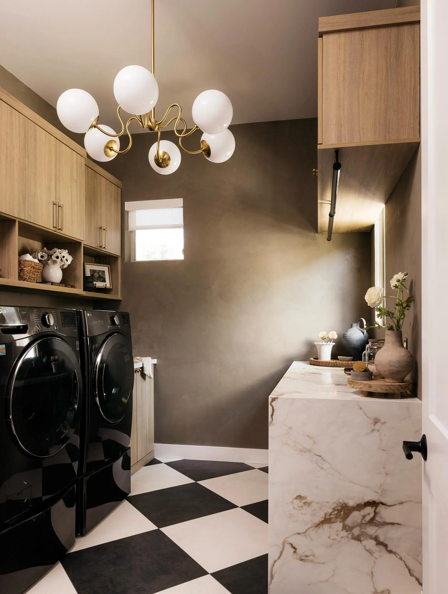Who knew doing laundry could feel so chic?

Design + Styling | @mckenziecorrendesigns 
Construction | @rykarconstruction 
Porcelain Fabrication + Installation | @customstoneworksaz 
Roman Clay | @kowalskipainting 
Plumbing | @brizofaucet 
Countertops