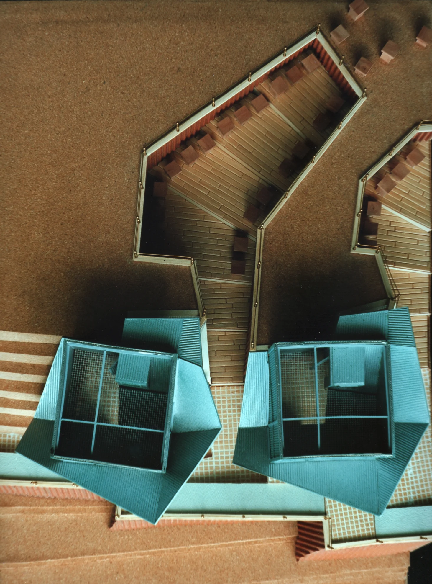 The resident beekeepers farm houses: each farmhouse has two levels – one that interfaces with the plateau and one with the workshop/ teaching area below.