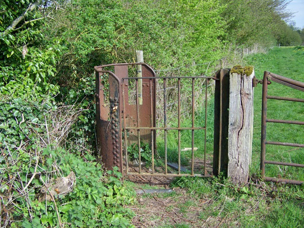 Industrial Era Stile- Here, use of cast iron in the design of a stile is indicative of adjacency with industry and utility. Could we be closing in on the city?