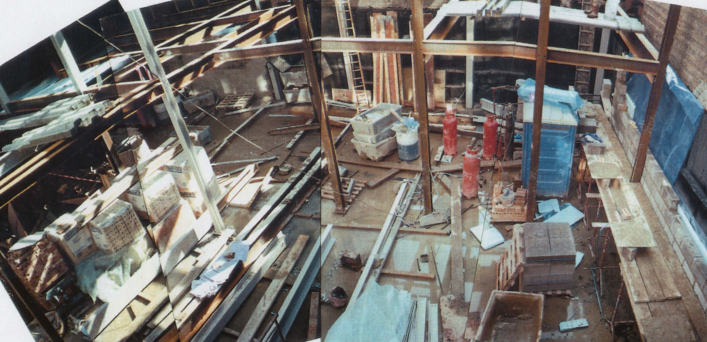 Construction progress photo: congestion on site caused delays and coordination problems. The masonry contractor went bankrupt during the project.