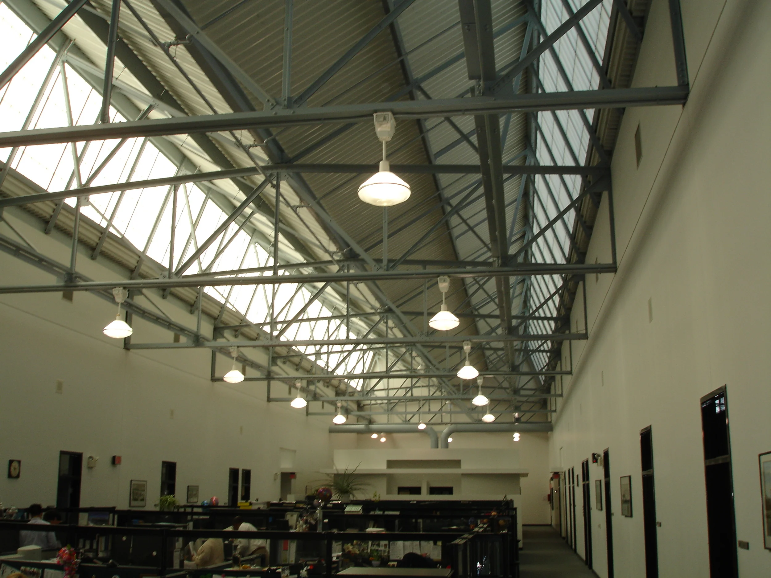 Photo 3: Interior of HMFA showing steel roof structure (above) and Kallwall window replacement system from renovation of earlier years.