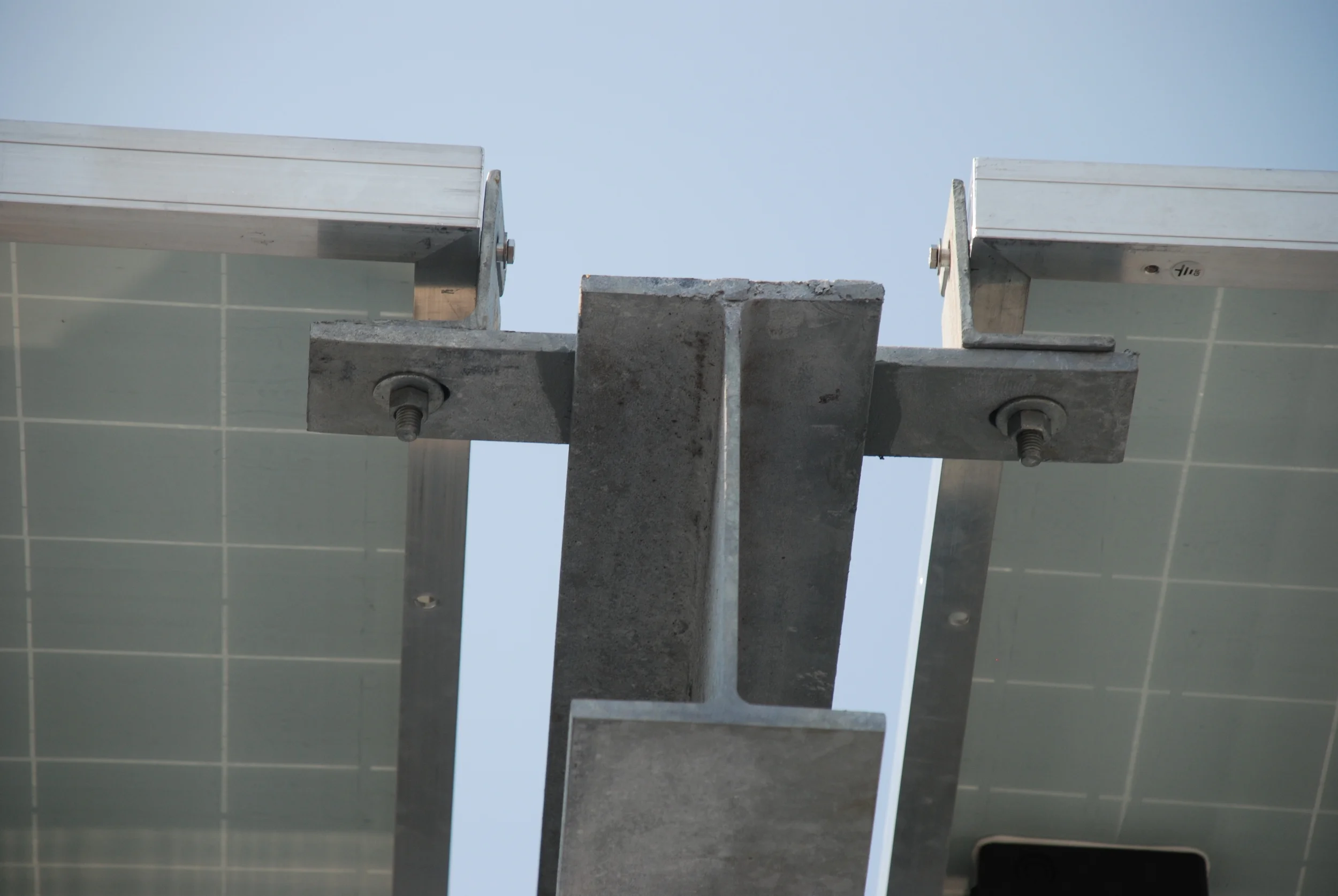 Photo 6: Photo showing assembly of brackets and beams used to attached the solar modules to the superstructure. This attachment method used manufacturer's mounting pins supplied with the equipment.