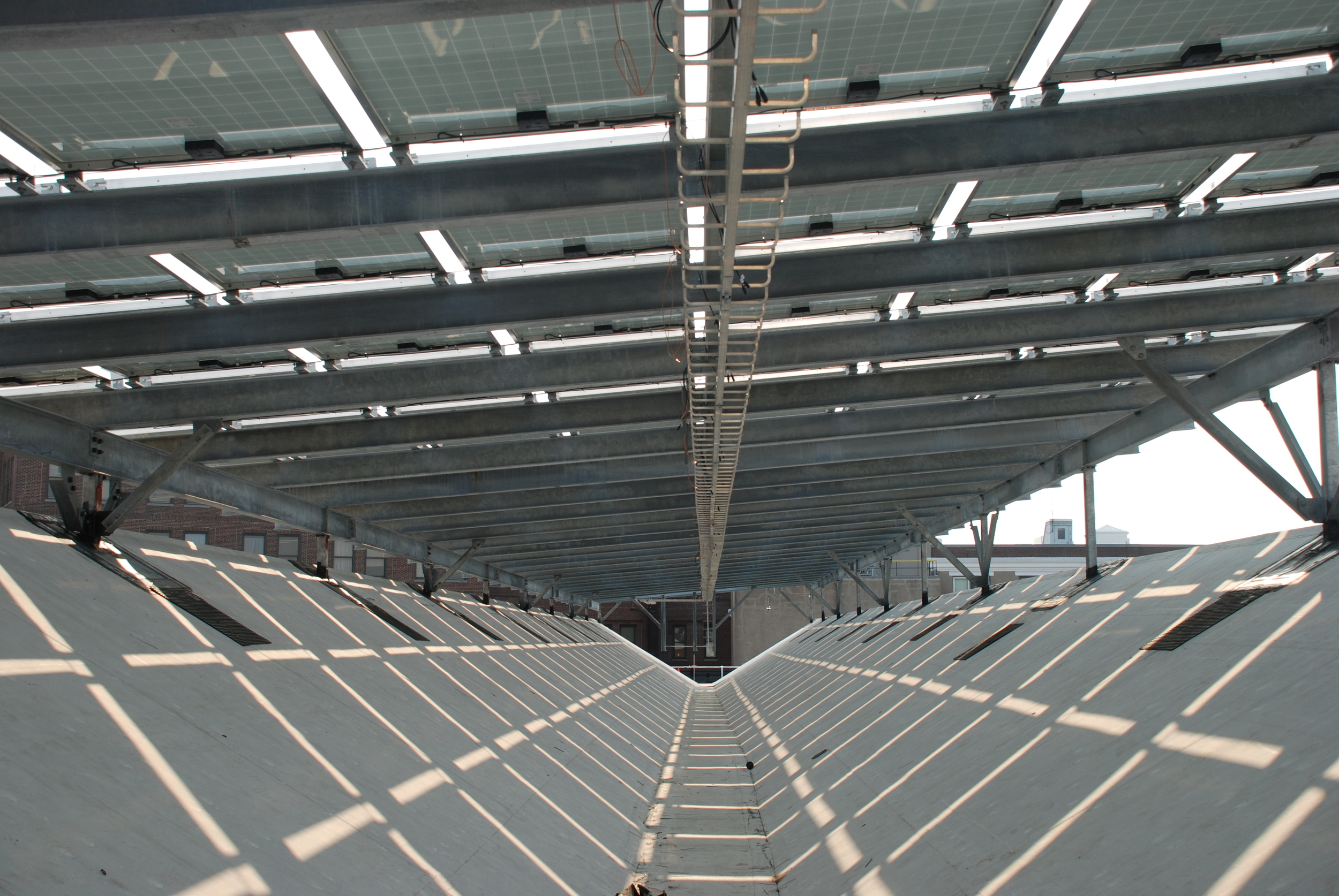Photo 12: View under the span showing cable tray as the dc electrical distribution method.
