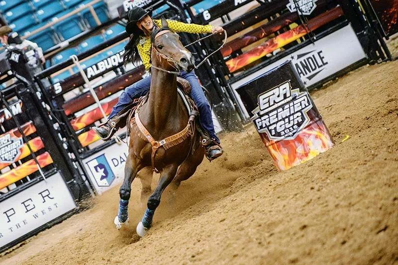 Navajo Times | Adron Gardner Kassidy Dennison rounds the final barrel during the 2016 ERA Premier Tour rodeo at Tingley Coliseum in Albuquerque Friday. Dennison finished with a time of 14.29 seconds.