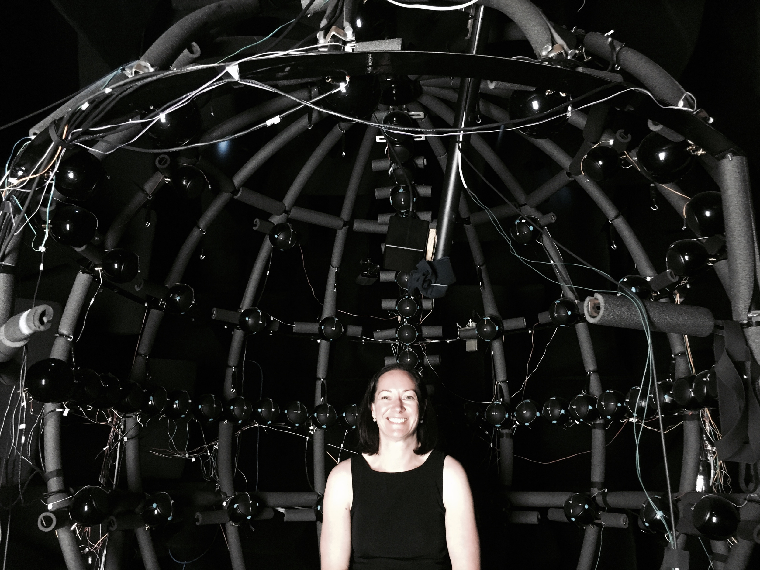Anita experiencing The Dome technology for measuring movement and sound connections at BRAMS Lab Montreal