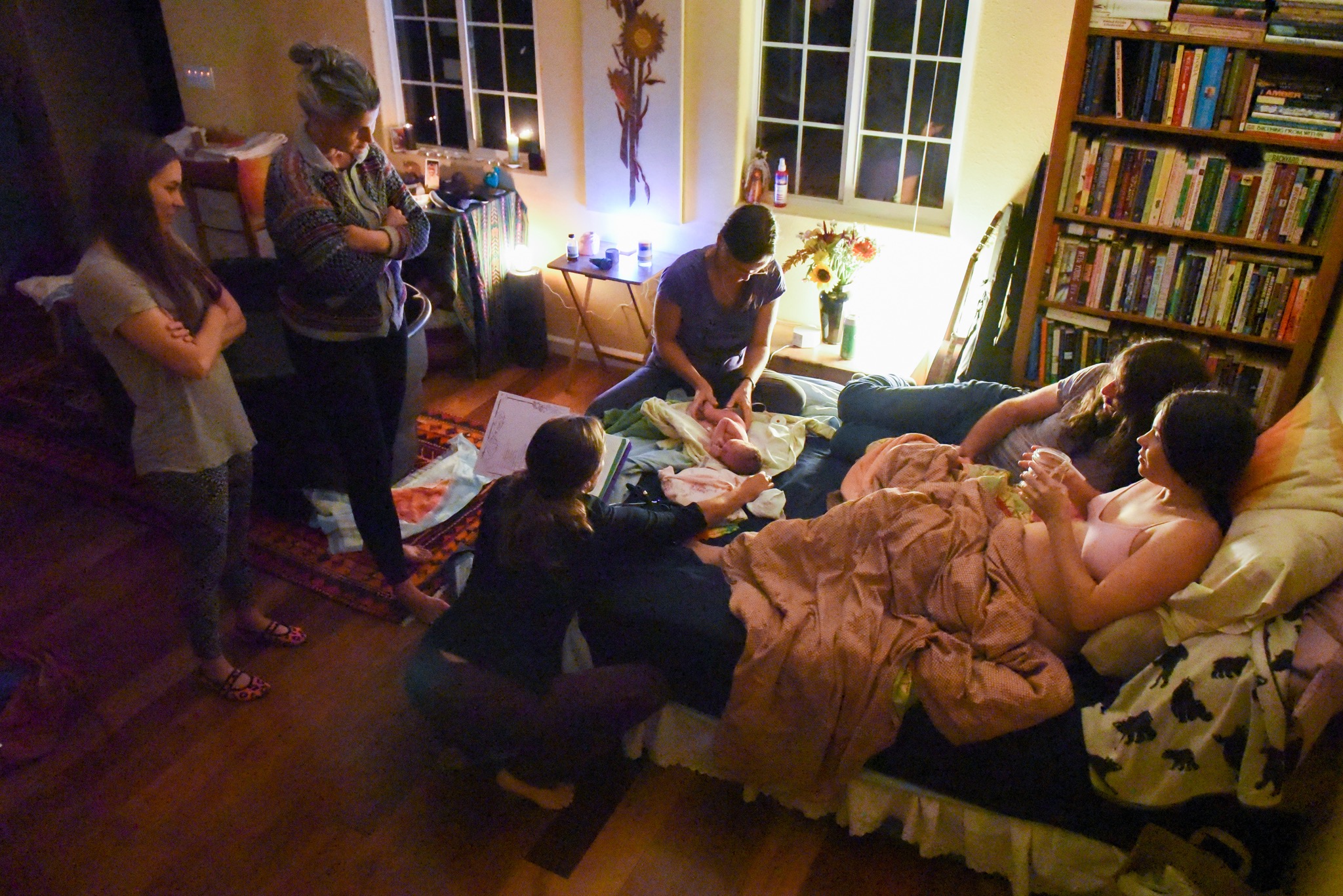 I adore this shot of the whole scene. My dad always says, "It's amazing how a bunch of grown-ups can all be in a room together, but if a baby's also in that room none of them are going to be paying attention to anything but that baby."