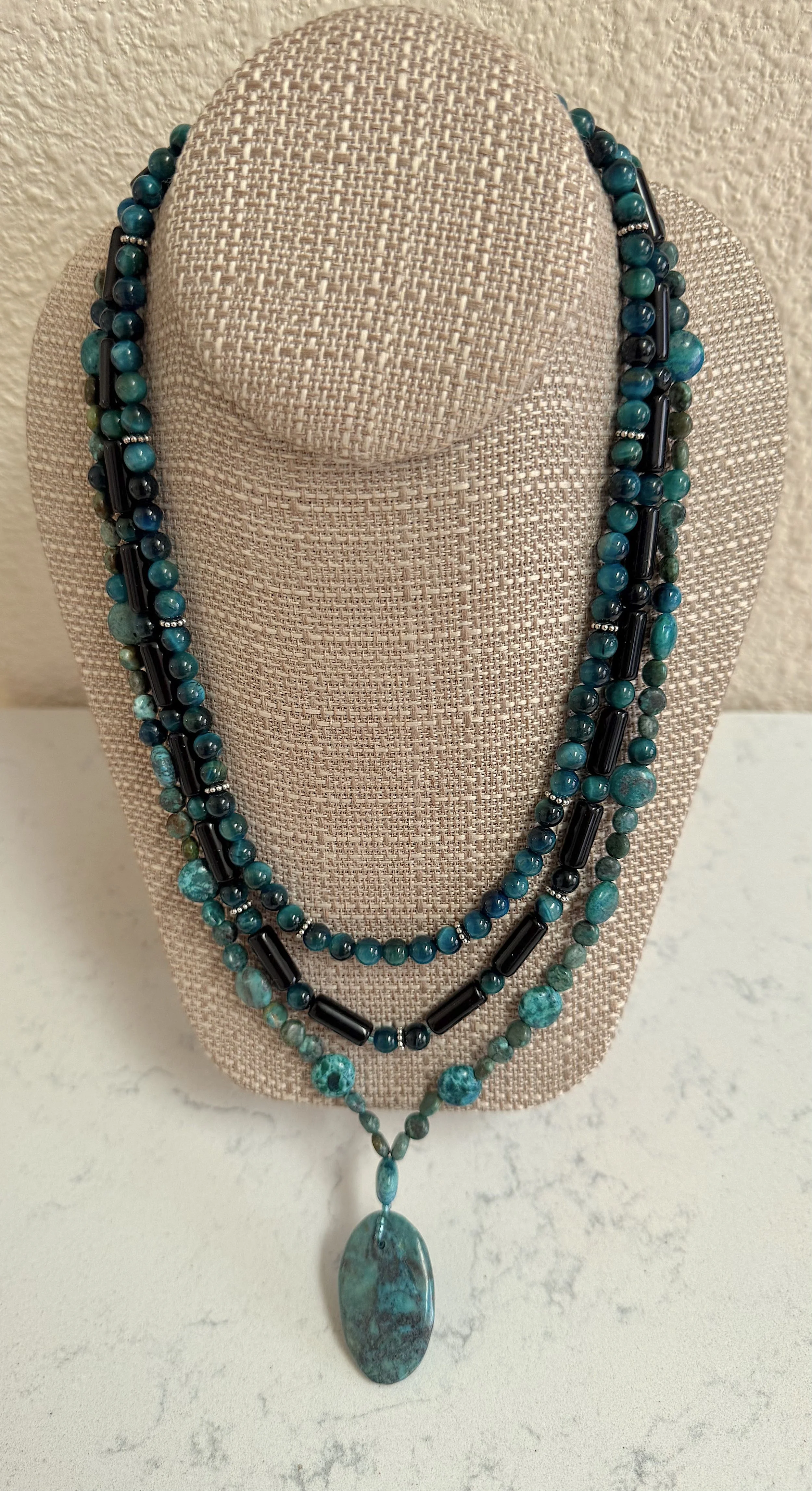 Madrid neckkace on stand.jpeg (Copy)