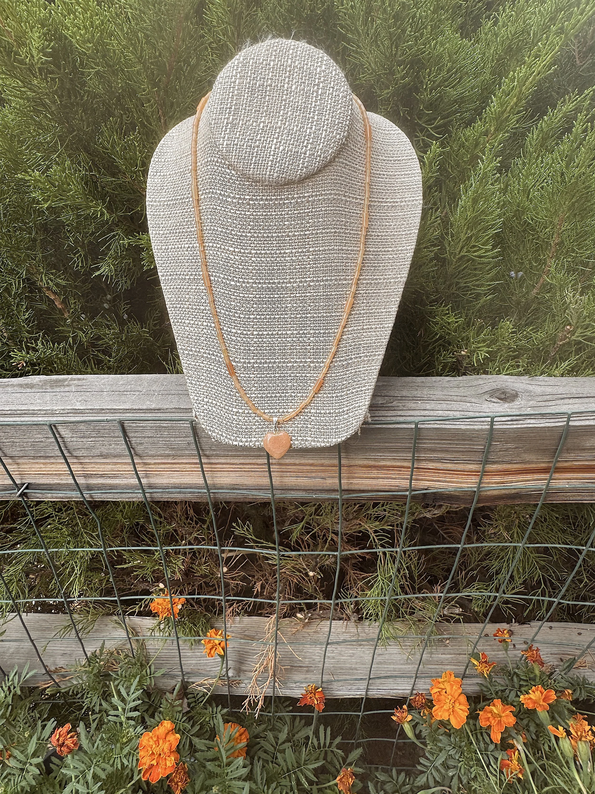 Apricot Heart juniper and marigolds.jpeg