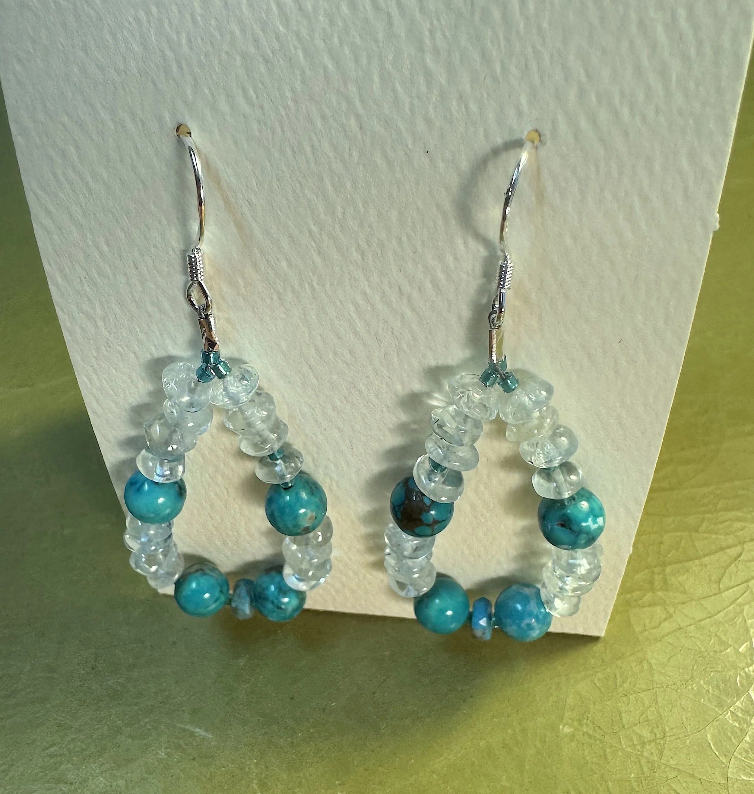 Aquamarine ad Turq hoops on stand.jpeg