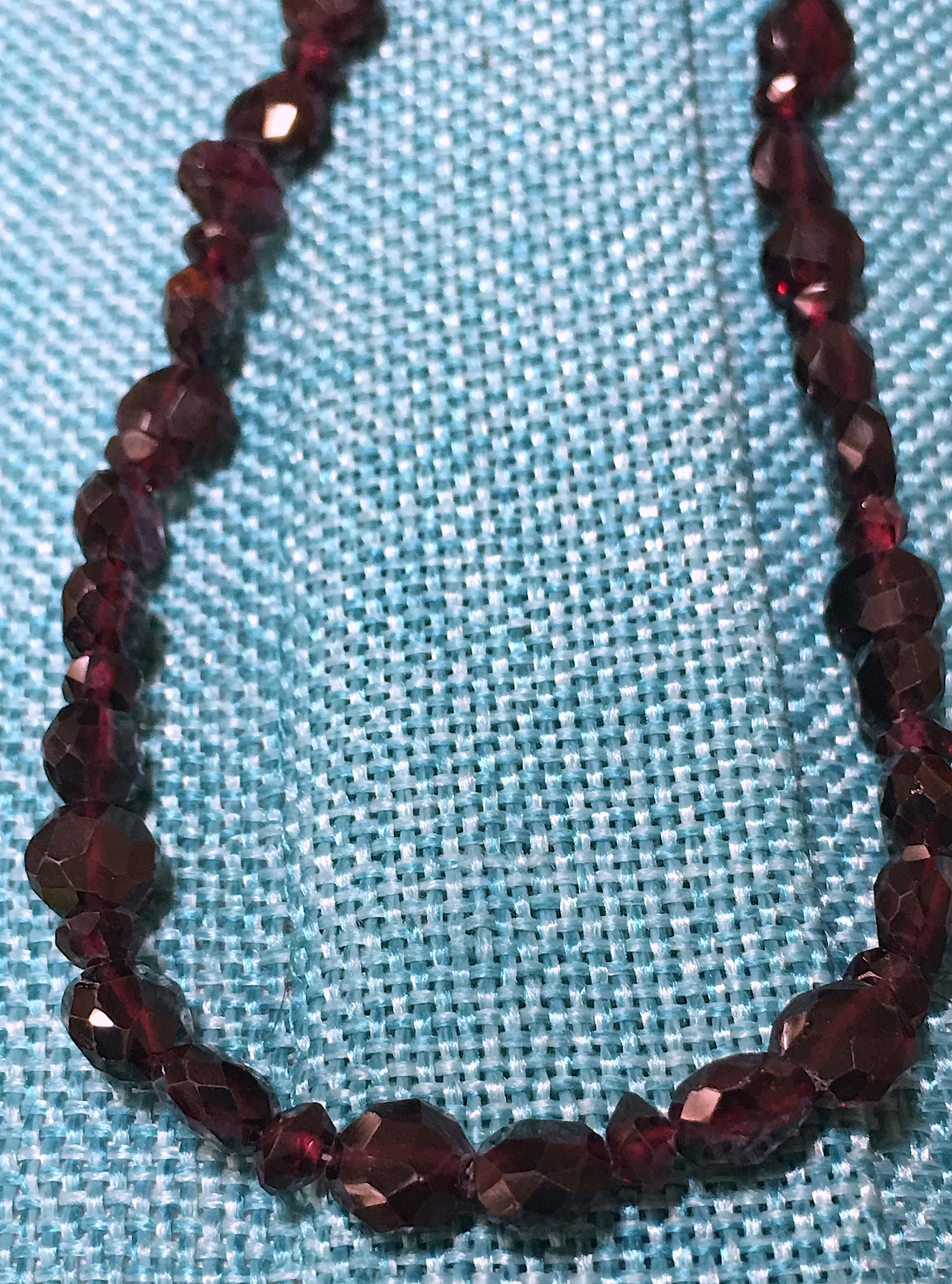 Faceted Garnet coins closeup.JPG