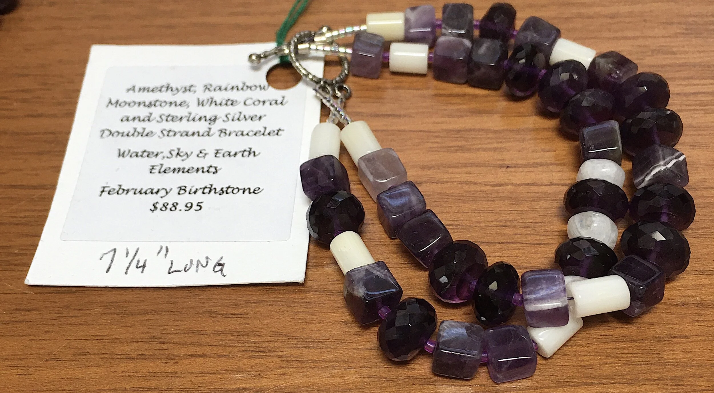 White ARrow brac with tag.jpg