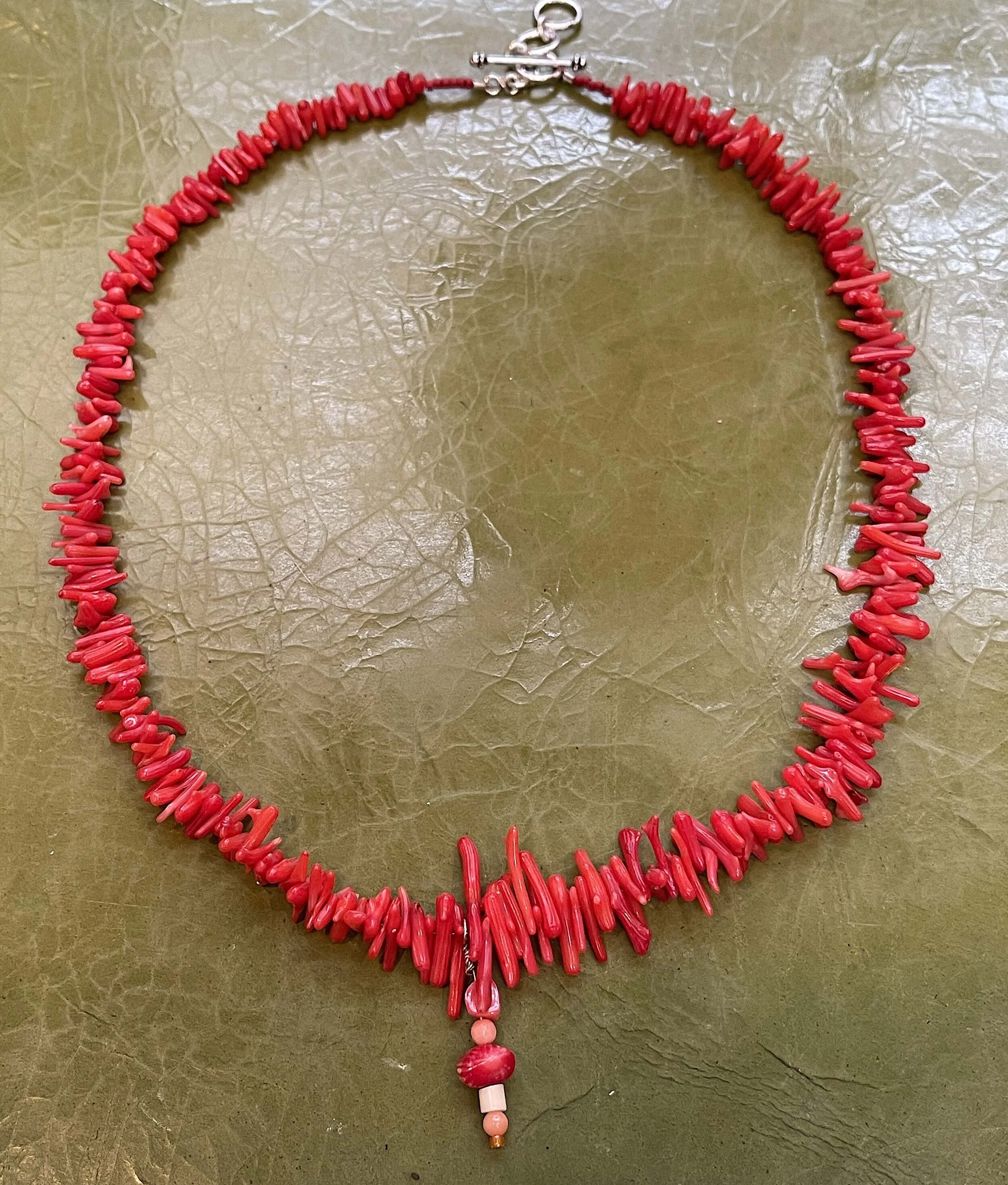 red Coral Capolini full on green.jpg