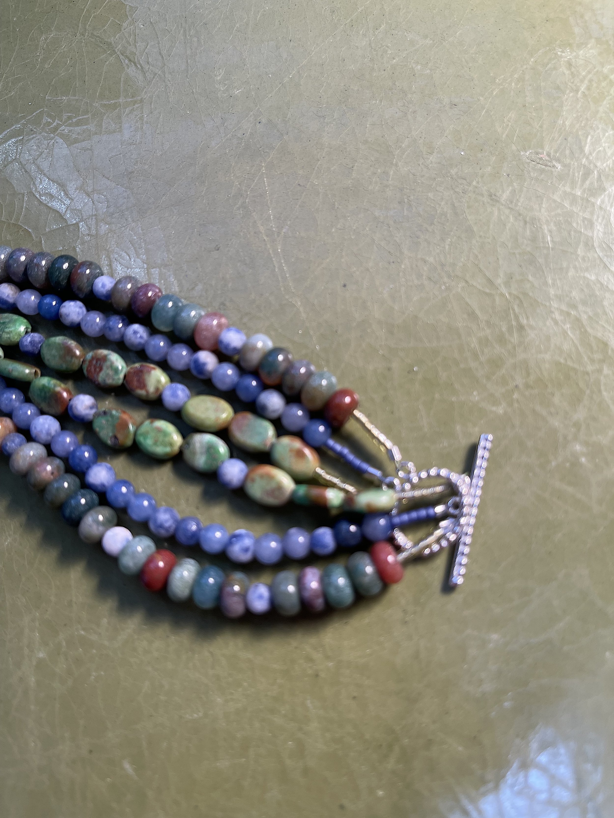 Juniper Berries clasp on green.jpg