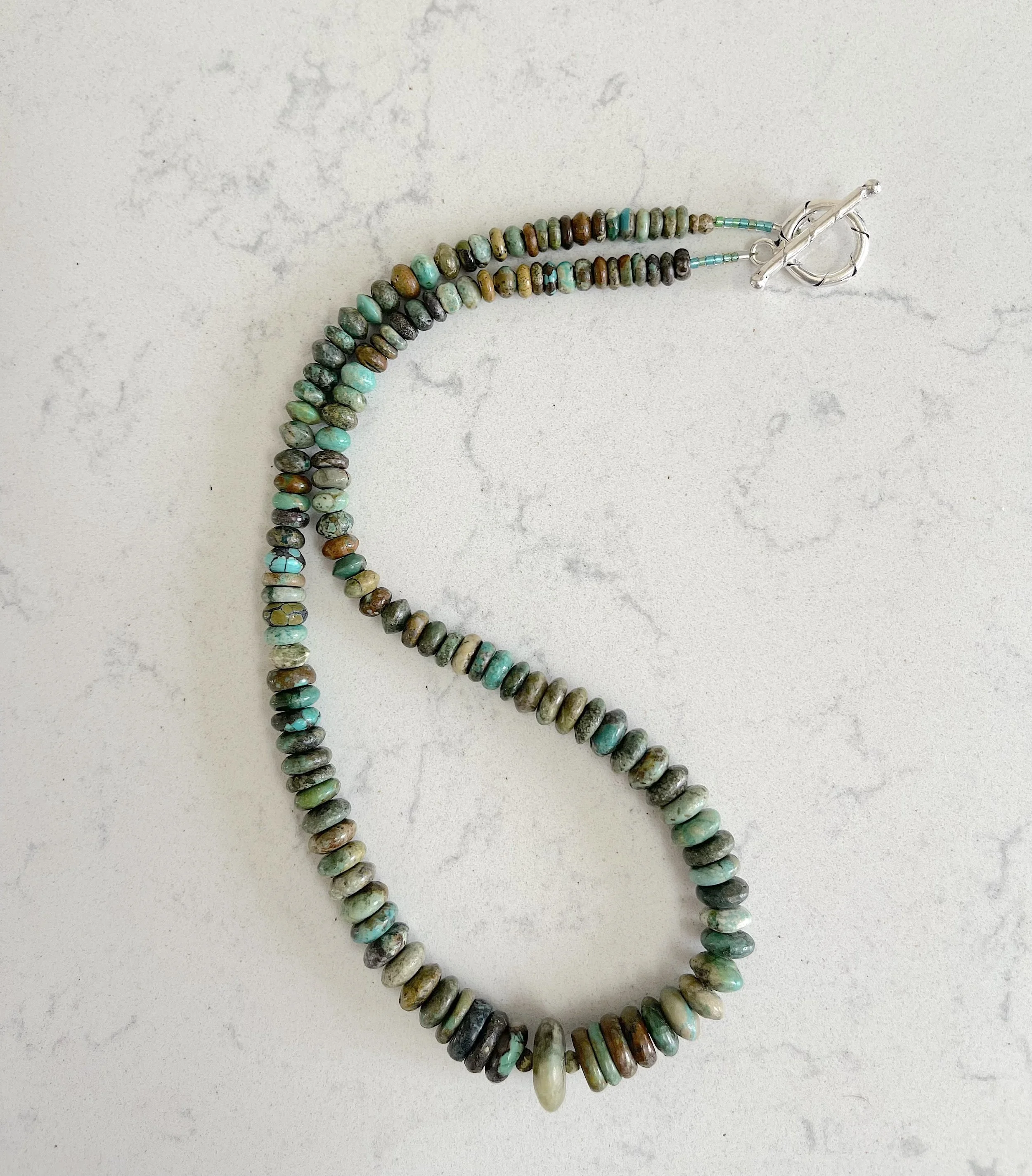 Graduated Turq curved on quartz.jpg