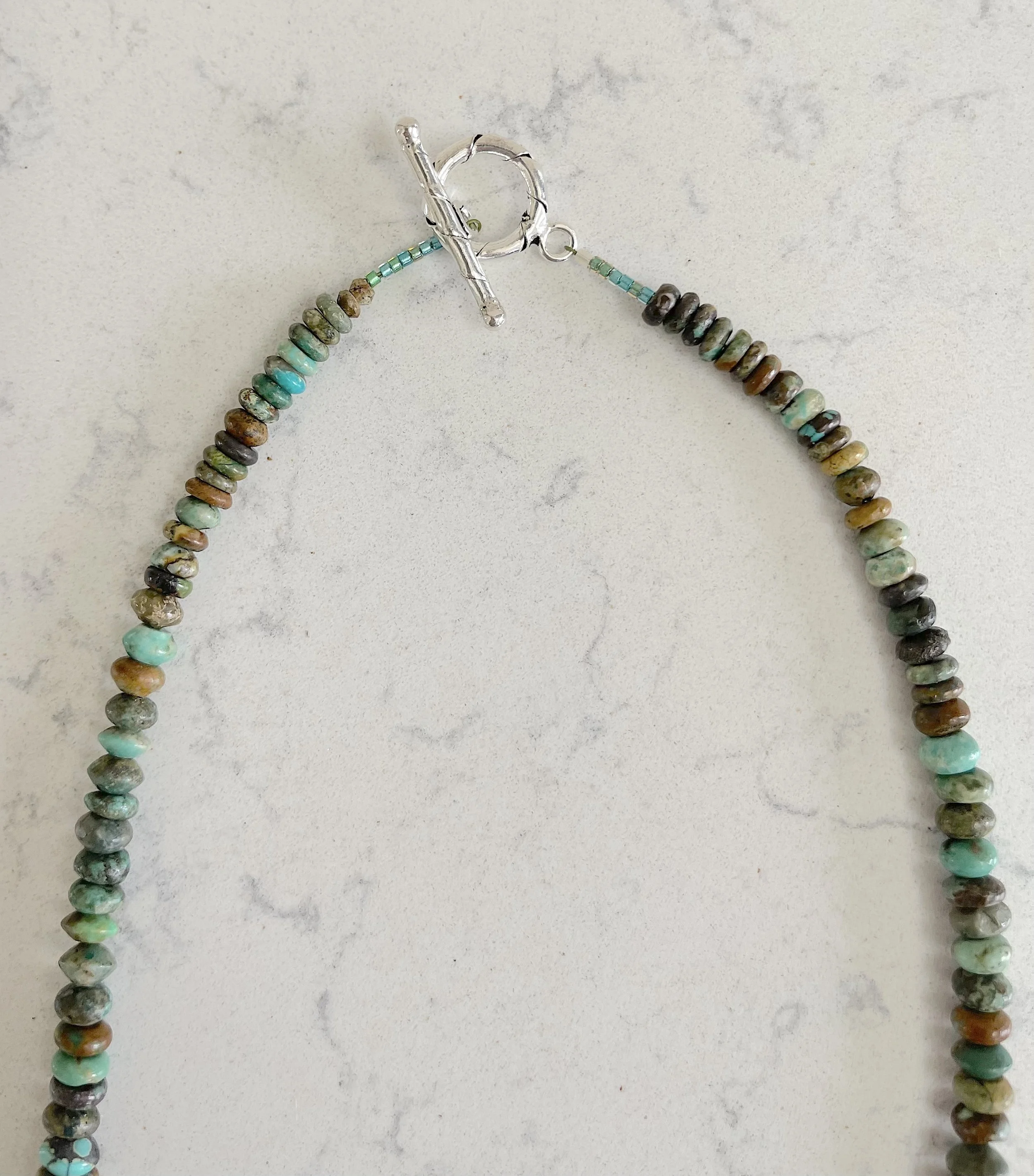 Graduated Turq clasp on quartz.jpg