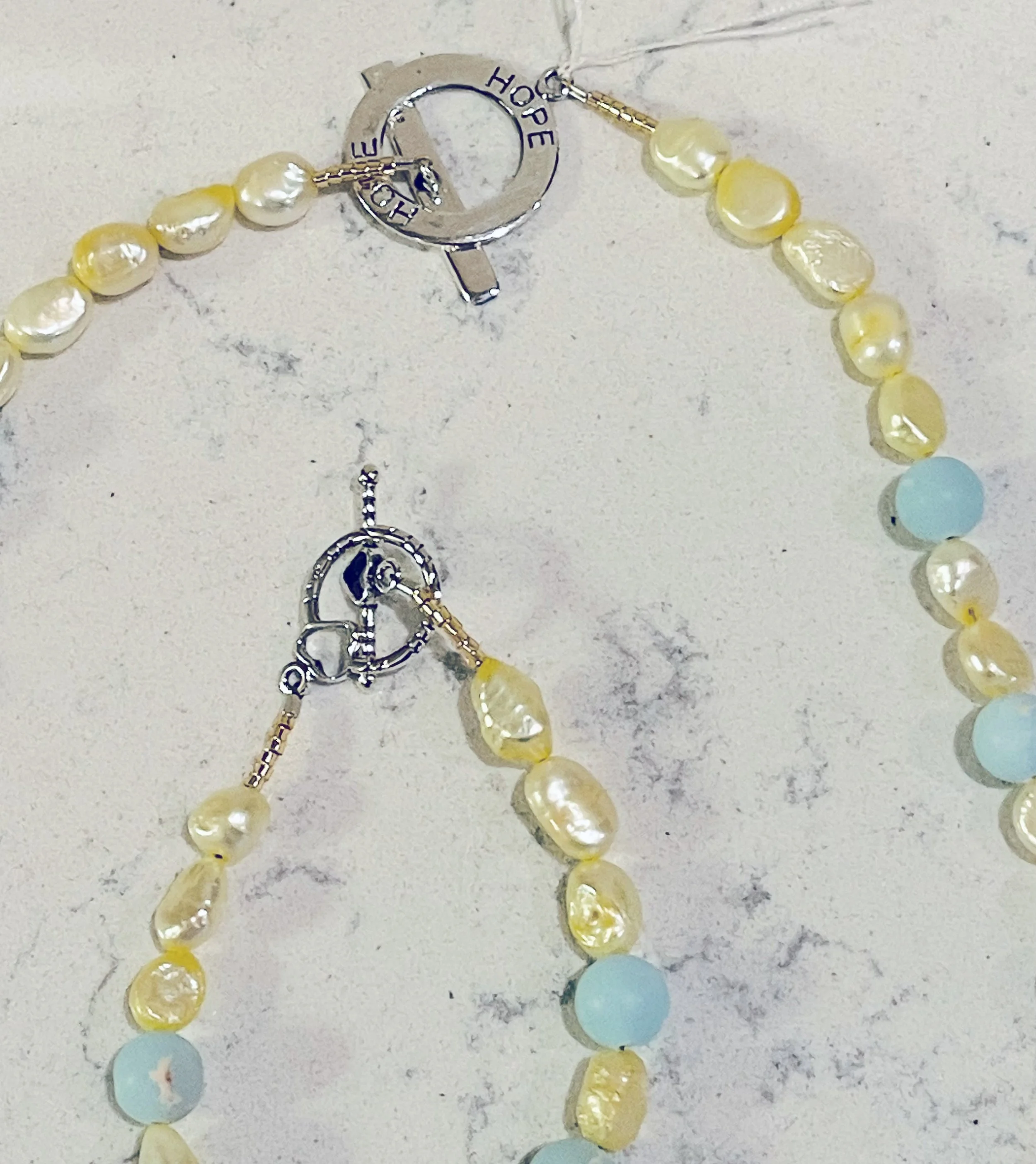 Solid 18 clasps on quartz.jpg