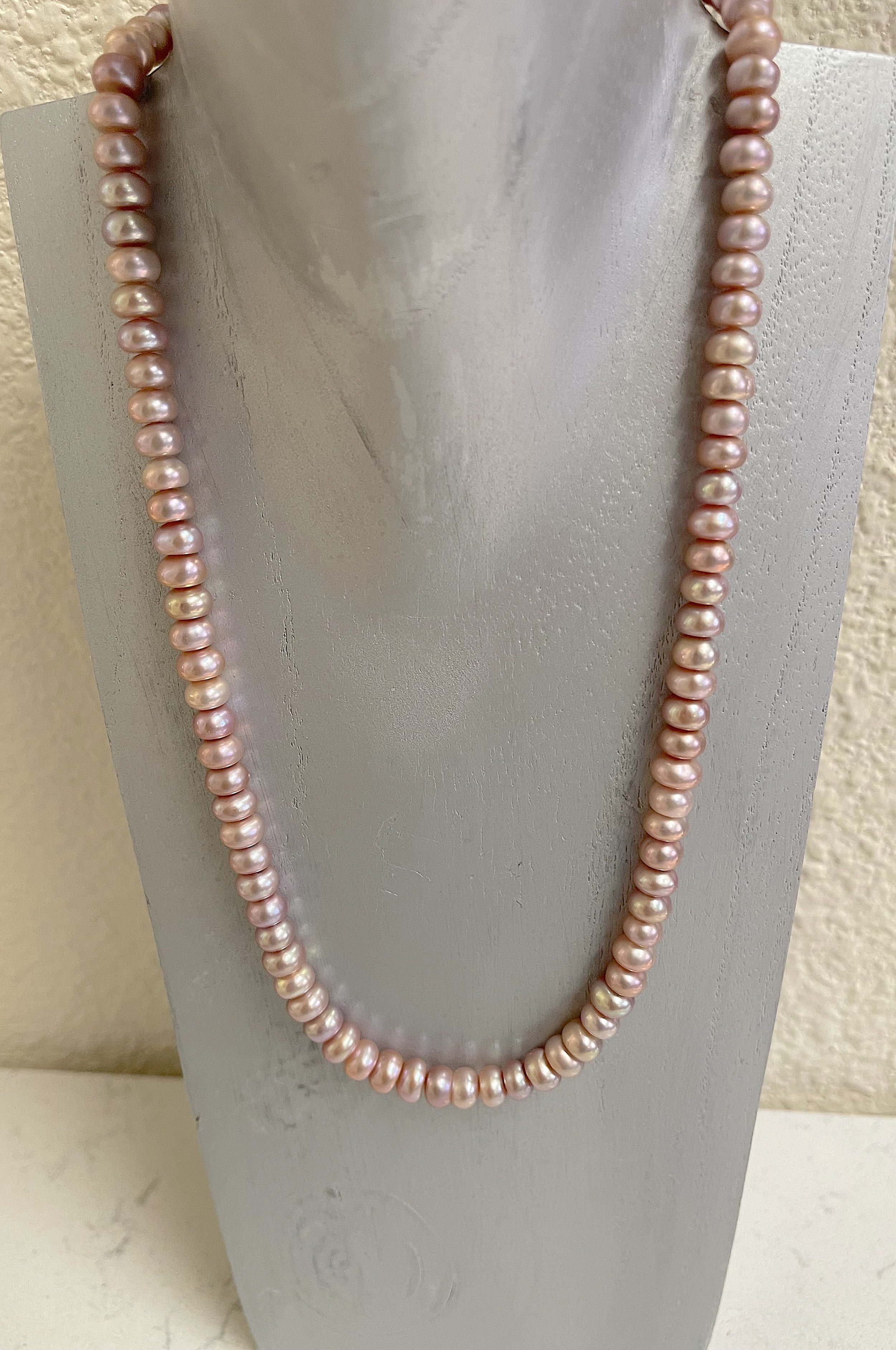 Mauve button pearls on grey stand.jpg