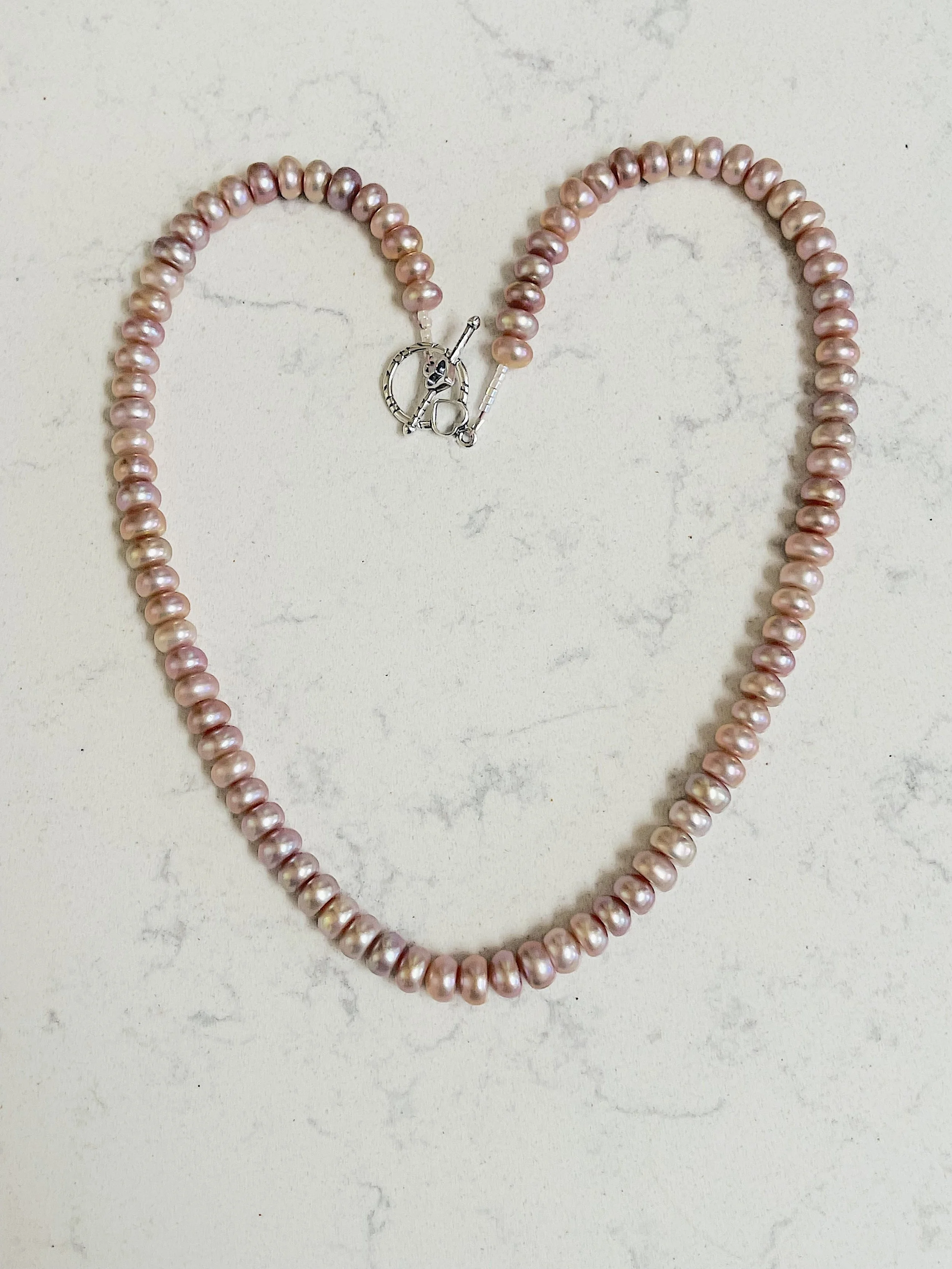 mauve button pearls in heart shape.jpg