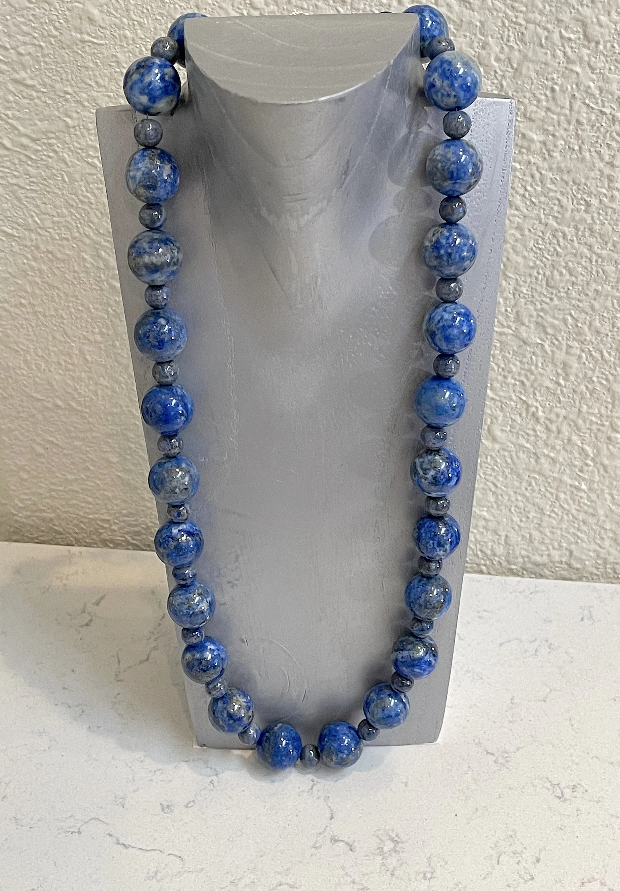 Earth on gray stand.jpg