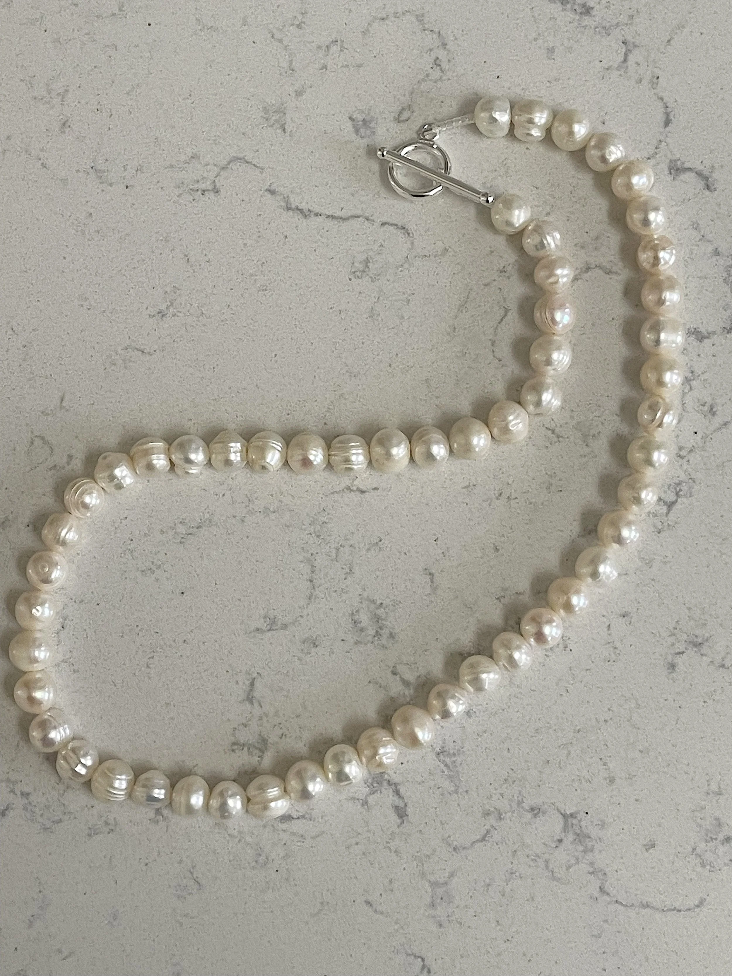 White Semi-Round Pearls curved.jpg