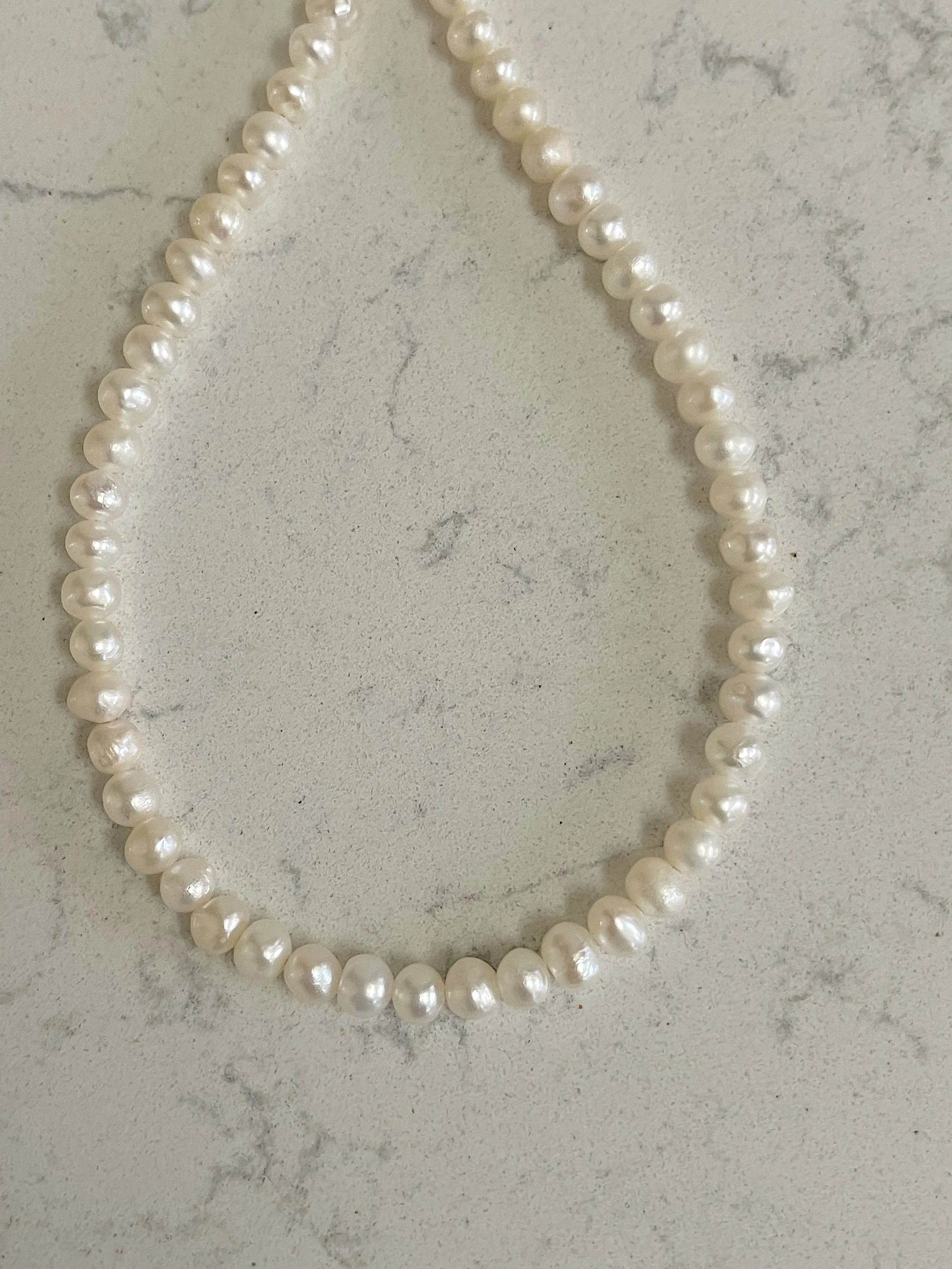 Cultured Semi-round pearls closeup.jpg