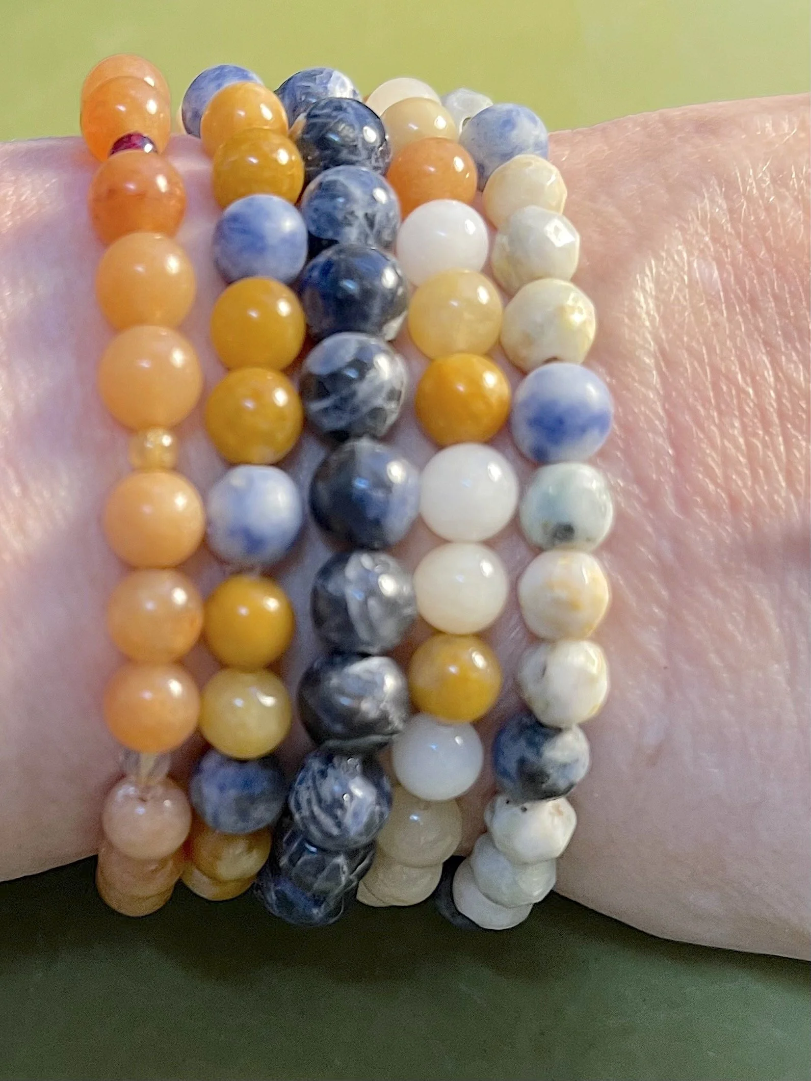 Stacked Energy Bracelet collection of blues and oranges.jpg